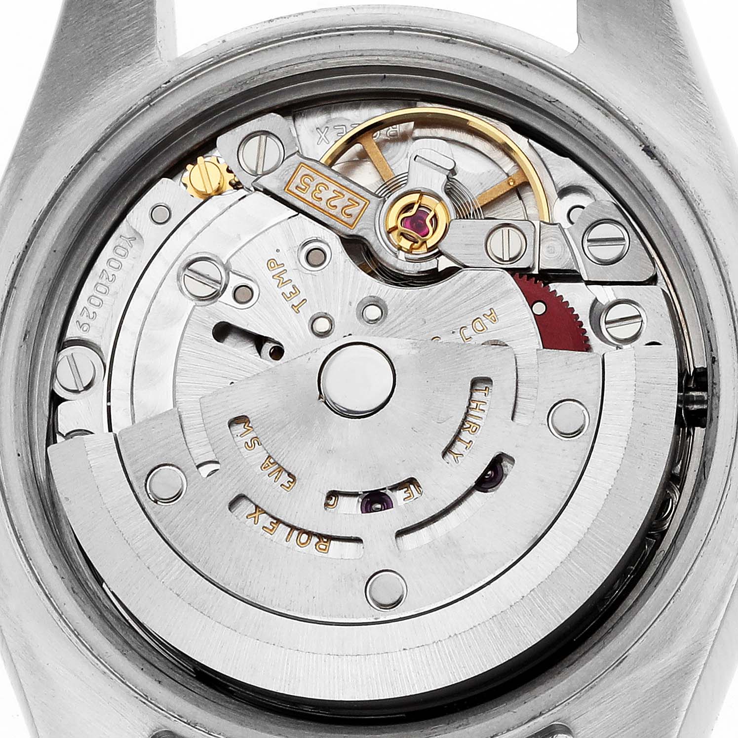 The image shows the movement of a Rolex Datejust 179383 Women
s Steel and Gold (two tone) White Dial watch from a top-down angle, highlighting its intricate internal mechanism.