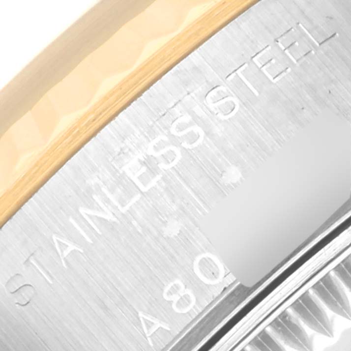 The image shows a close-up of the side engraving on a Rolex Datejust 79173 Women's Steel and Gold (two tone) Mother of Pearl Dial 79173 Women's Steel and Gold (two tone) Mother of Pearl Dial, highlighting the stainless steel material.