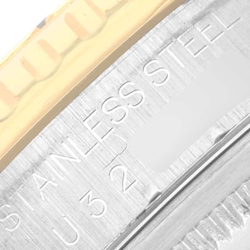 The image shows a close-up of the bezel edge and engraved text on the Rolex Turn-o-Graph 16263 Men
s Steel and Gold (two tone) Black Dial 16263 Men
s Steel and Gold (two tone) Black Dial
s stainless steel case.