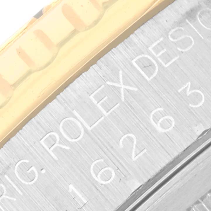 The image shows a close-up of the casing edge of a Rolex Turn-o-Graph 16263 Men
s Steel and Gold (two tone) Black Dial 16263 Men
s Steel and Gold (two tone) Black Dial, featuring part of the bezel and engraved model details.