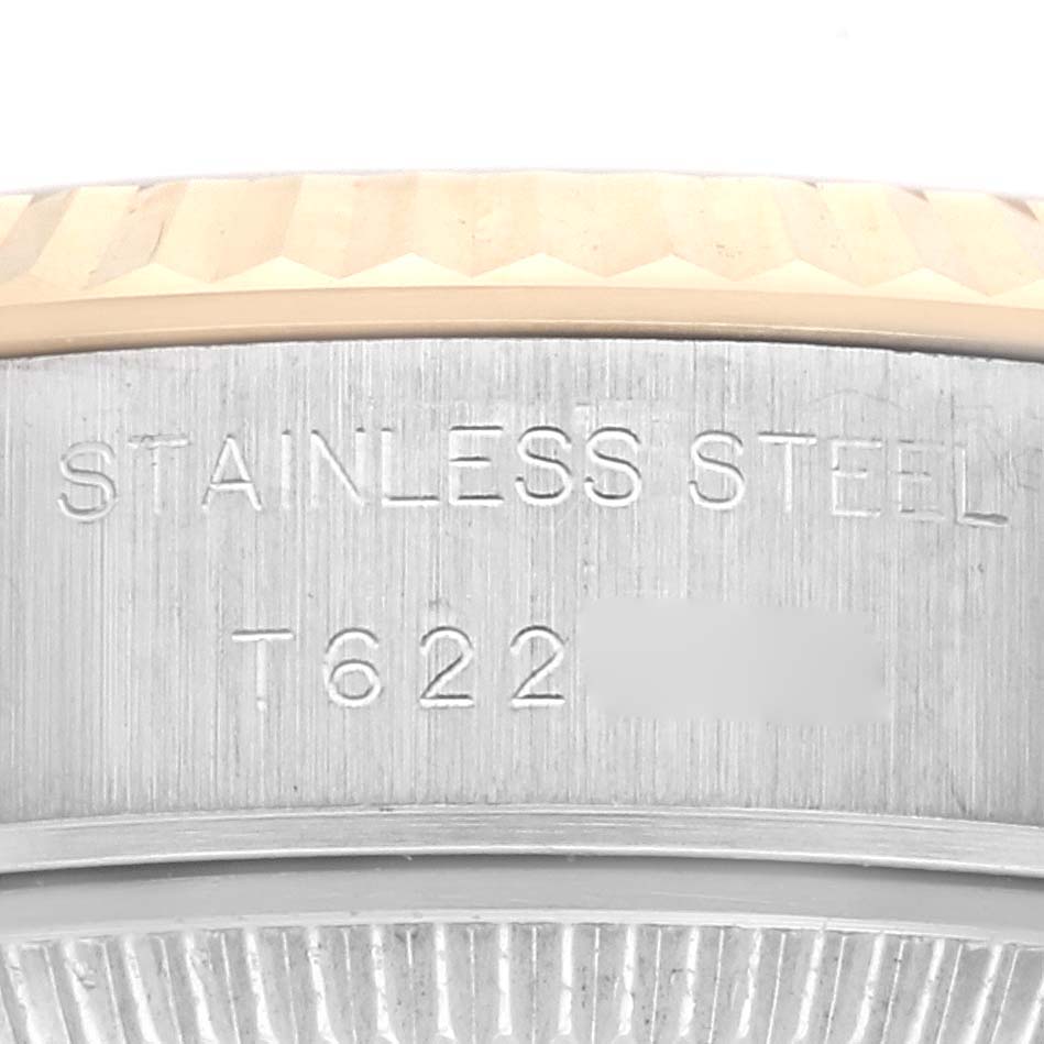 The image shows the side of a Rolex Datejust 69173 Women's Steel and Gold (two tone) White Dial 69173 Women's Steel and Gold (two tone) White Dial, displaying the bezel edge and part of the engraved stainless steel case.