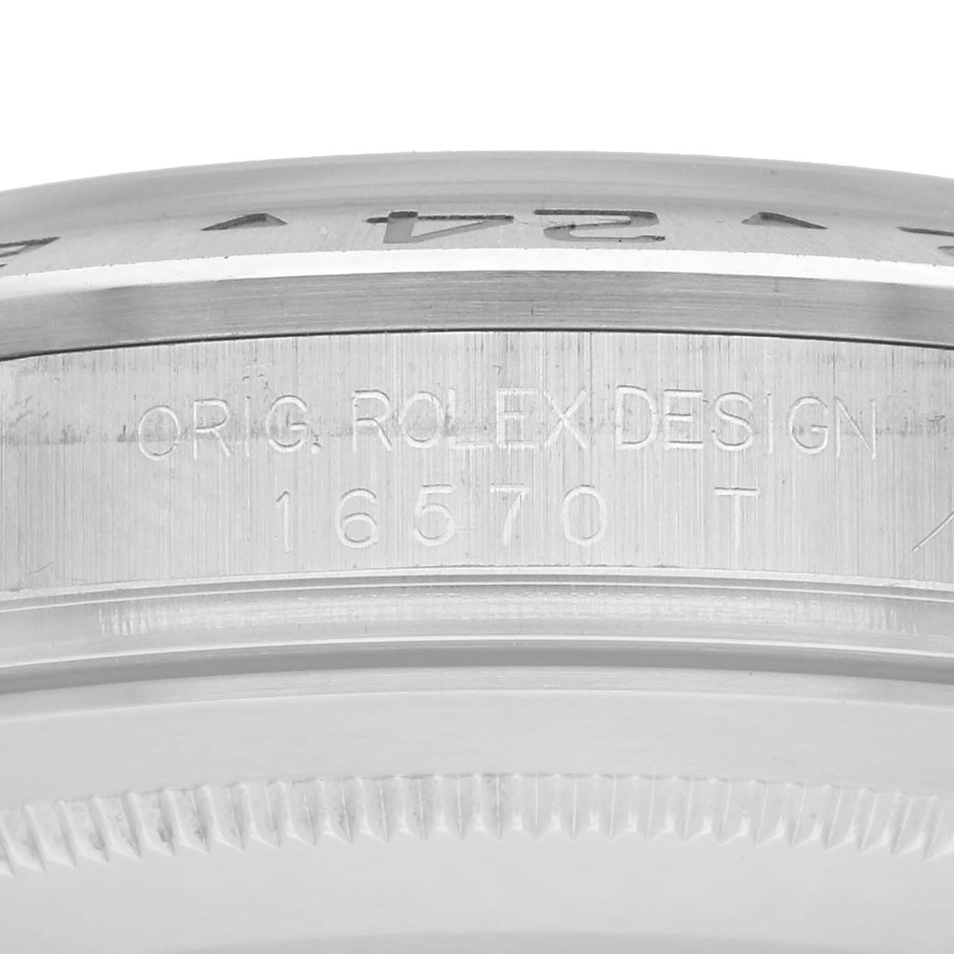 The image shows a close-up of the Rolex Explorer 16570 Men
s Stainless Steel Black Dial
s case side, highlighting model details engraved on the bezel.