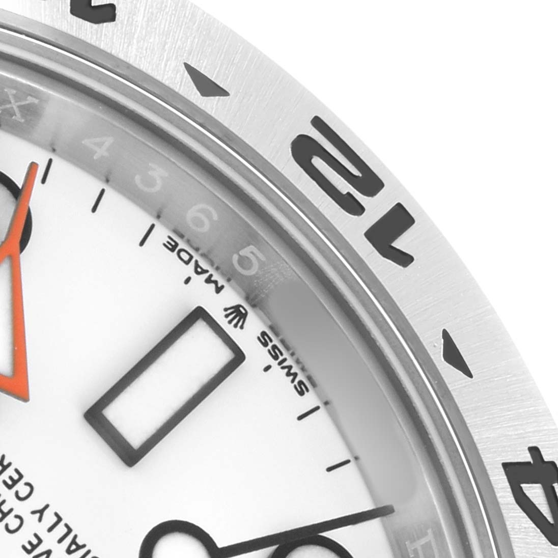 The image shows a close-up of the Rolex Explorer 226570 Men
s Stainless Steel White Dial watch, focusing on the bezel, dial, and partial hands.