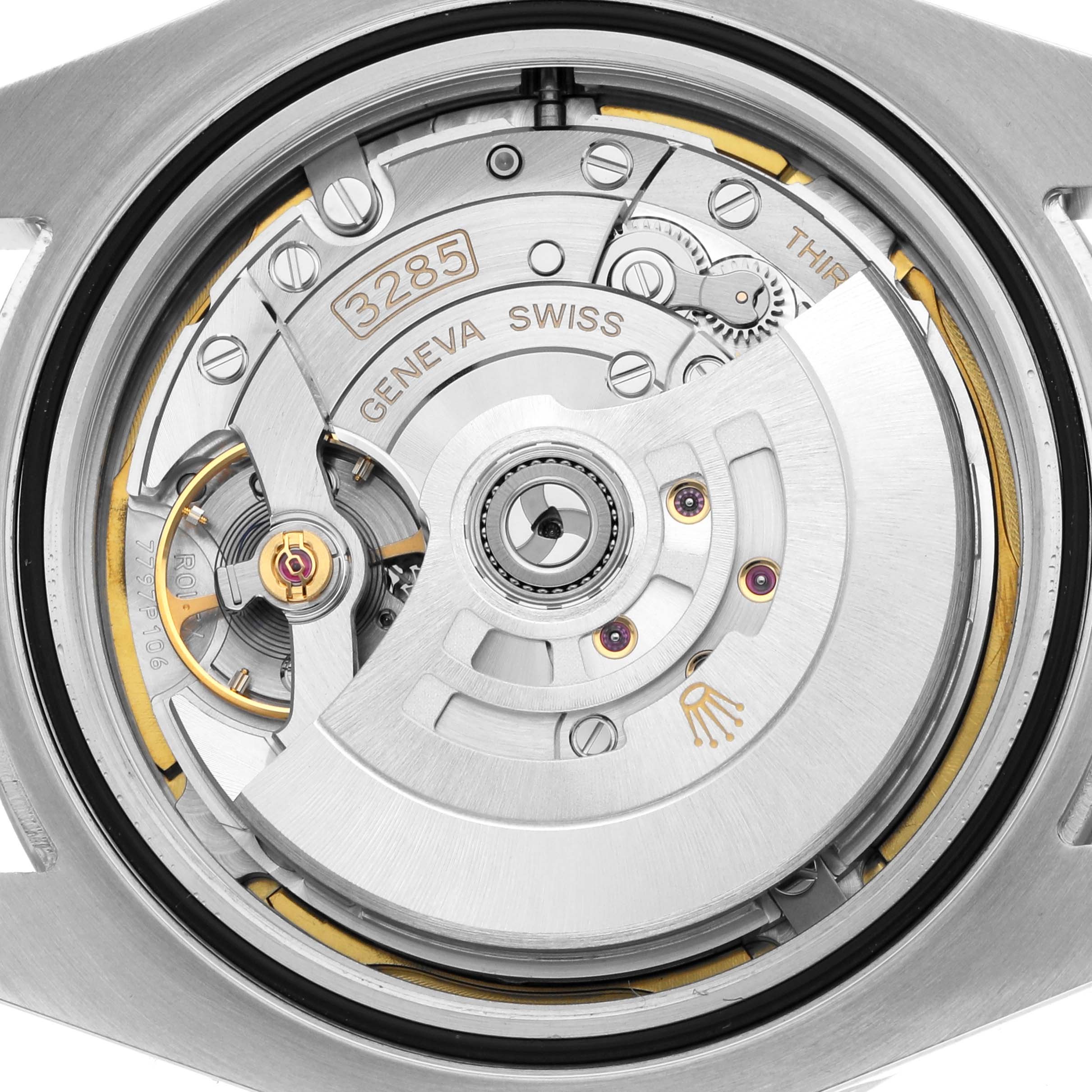 The image shows a close-up of the movement of the Rolex Explorer 226570 Men
s Stainless Steel White Dial, highlighting the rotor and internal mechanisms.