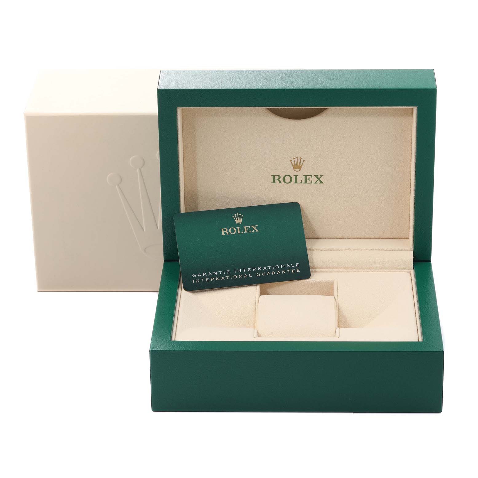 This image shows an open green Rolex watch box with an international guarantee card inside.