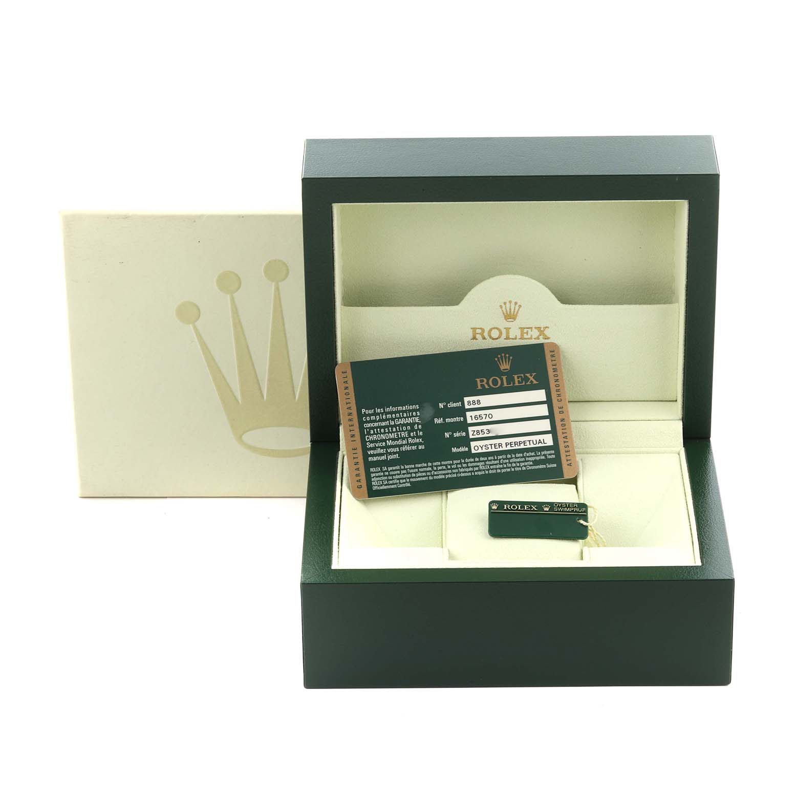 The image shows a Rolex Explorer 16570T Men's Stainless Steel Black Dial 16570T Men's Stainless Steel Black Dial box, warranty card, and tag at an eye-level angle.