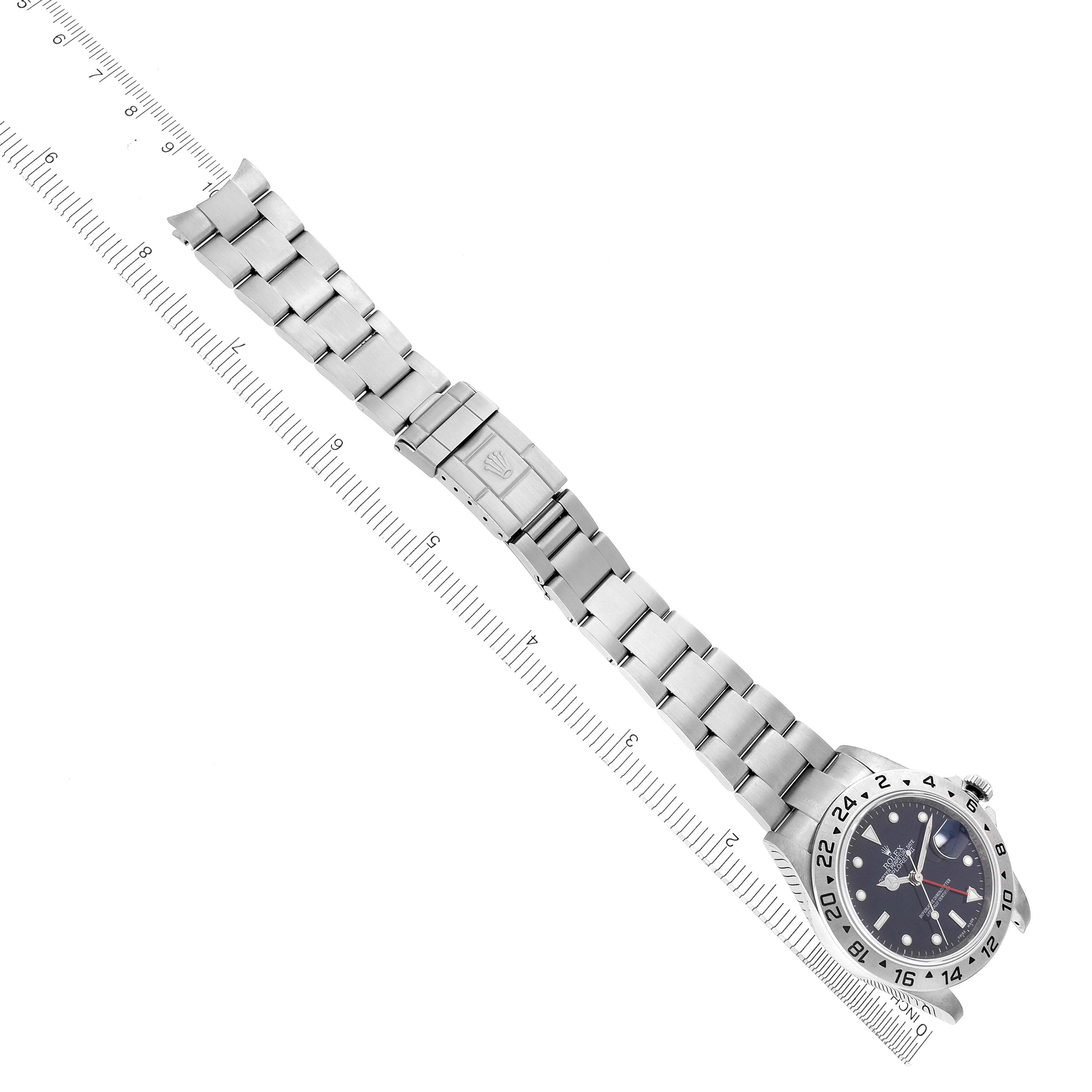 The Rolex Explorer 16570T Men's Stainless Steel Black Dial 16570T Men's Stainless Steel Black Dial watch is shown from a top view, displaying its face and full metal bracelet with a clasp.