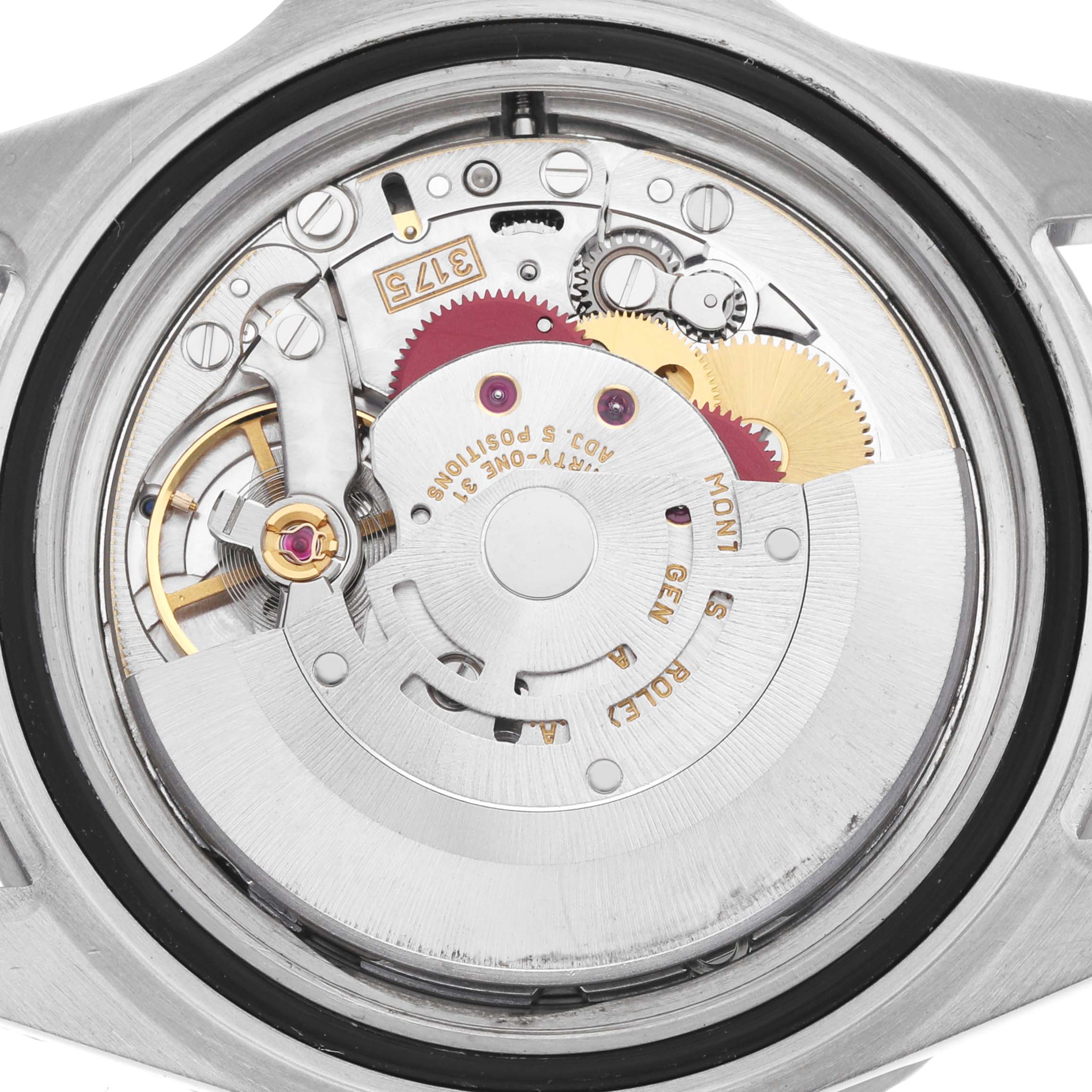 The image shows the back view of a Rolex GMT-Master 16700 Men
s Stainless Steel Black Dial watch, highlighting the intricate movement and internal components.