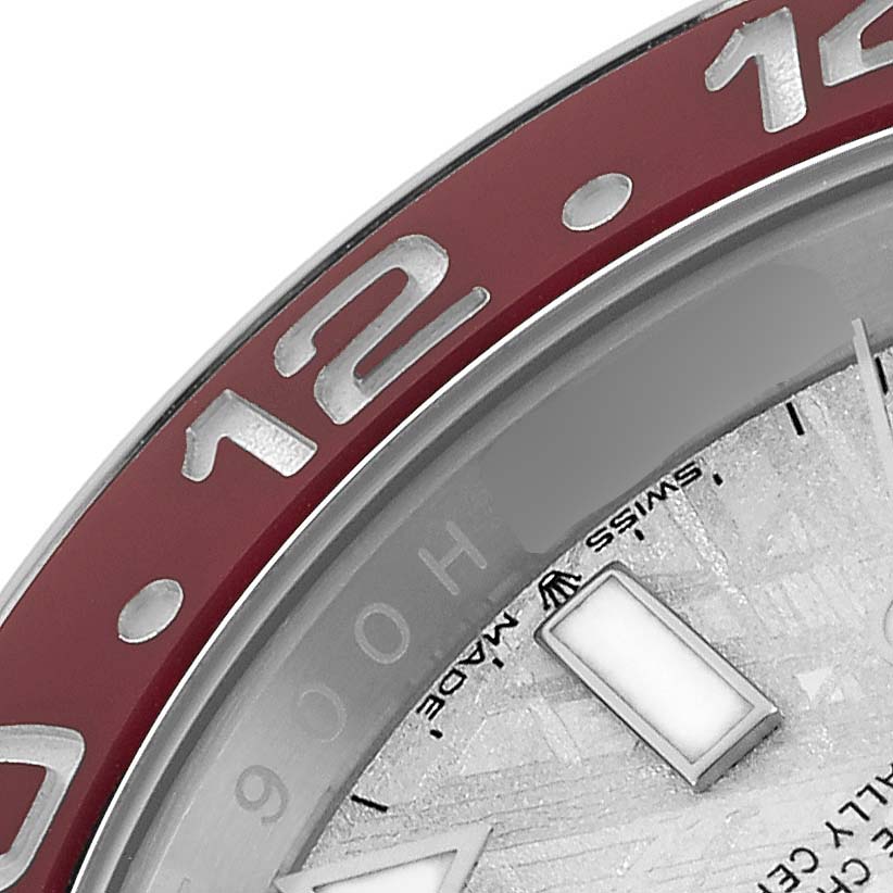 The image shows a close-up of the Rolex GMT-Master 126719 Men
s White Gold Silver Dial watch, focusing on the bezel and part of the dial.