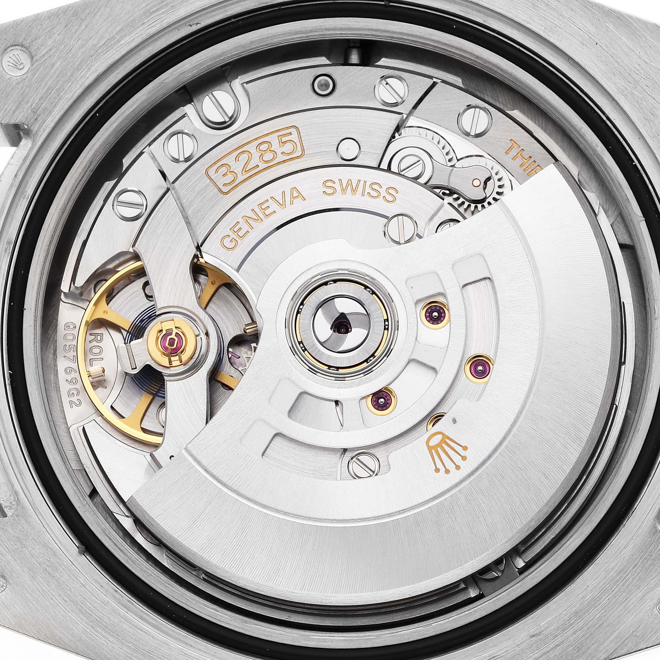The image shows the movement mechanism of a Rolex GMT-Master 126719 Men
s White Gold Silver Dial, featuring parts like the rotor and balance wheel, viewed from the back.