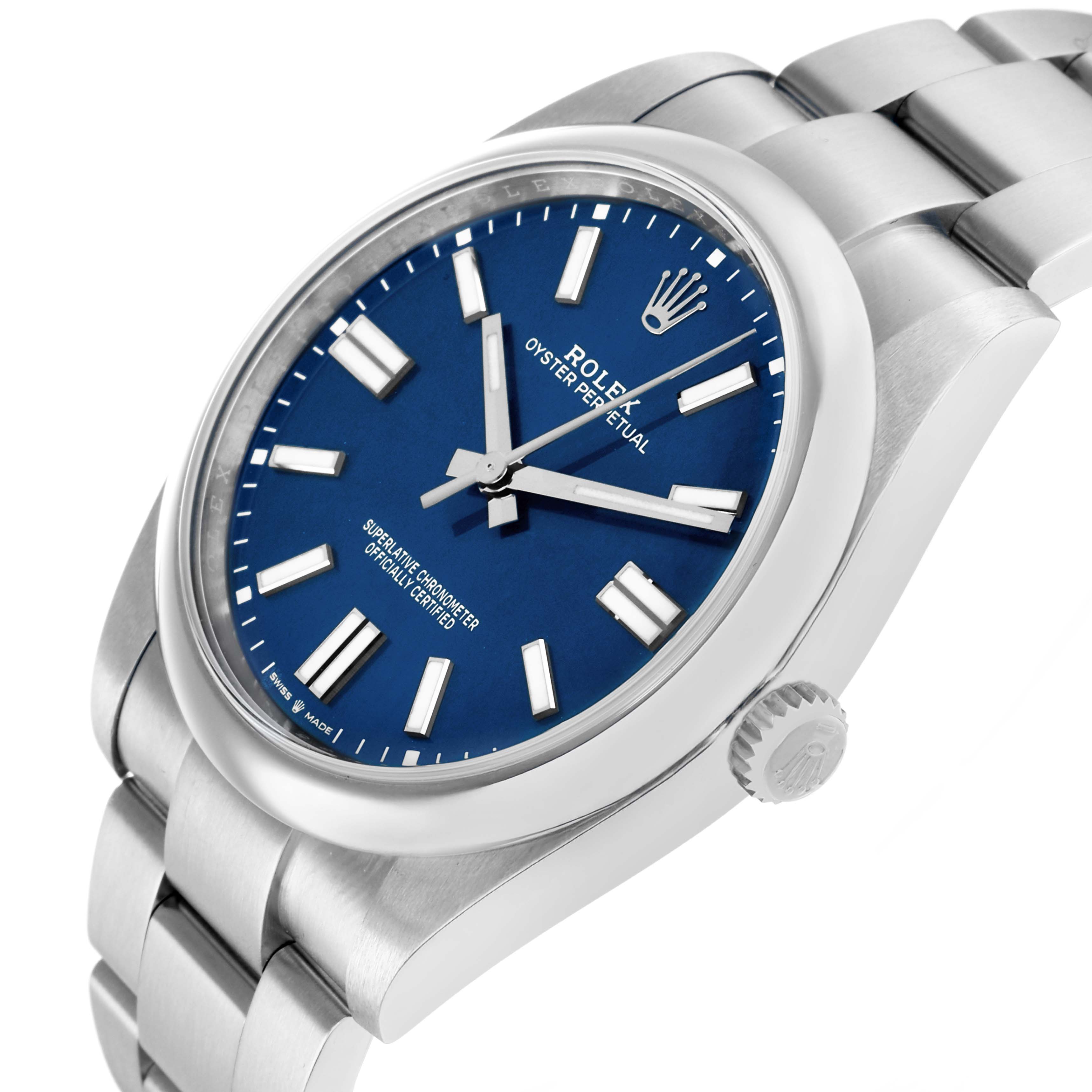 The Rolex Oyster Perpetual 124300 Men
s Stainless Steel Blue Dial watch is shown at an angle highlighting its blue dial, indices, crown, and upper bracelet links.