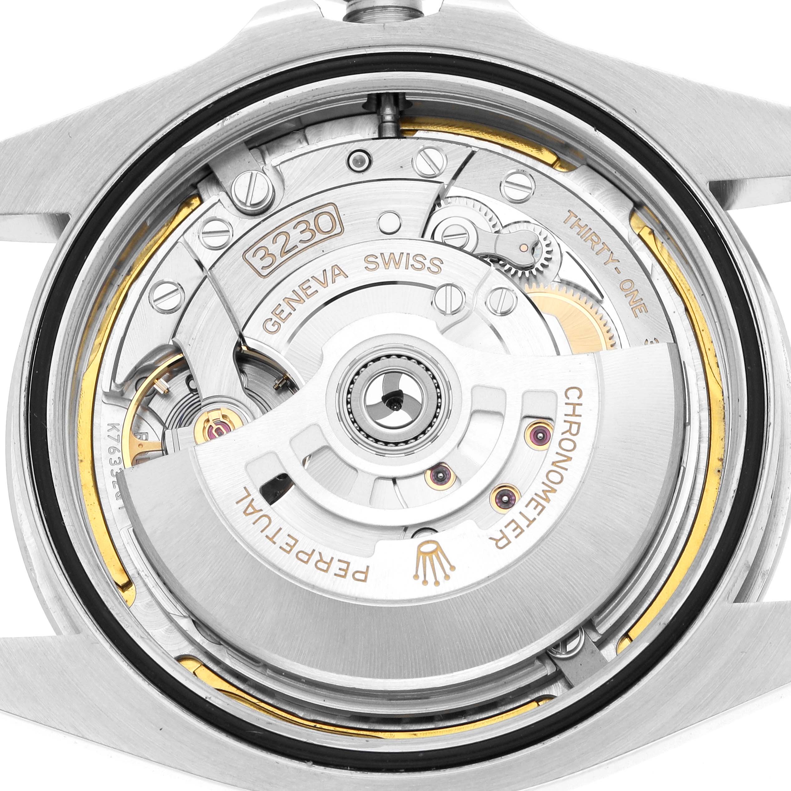 The image shows the movement of a Rolex Air-King 126900 Men
s Stainless Steel Black Dial watch from a top-down angle, highlighting its intricate components.