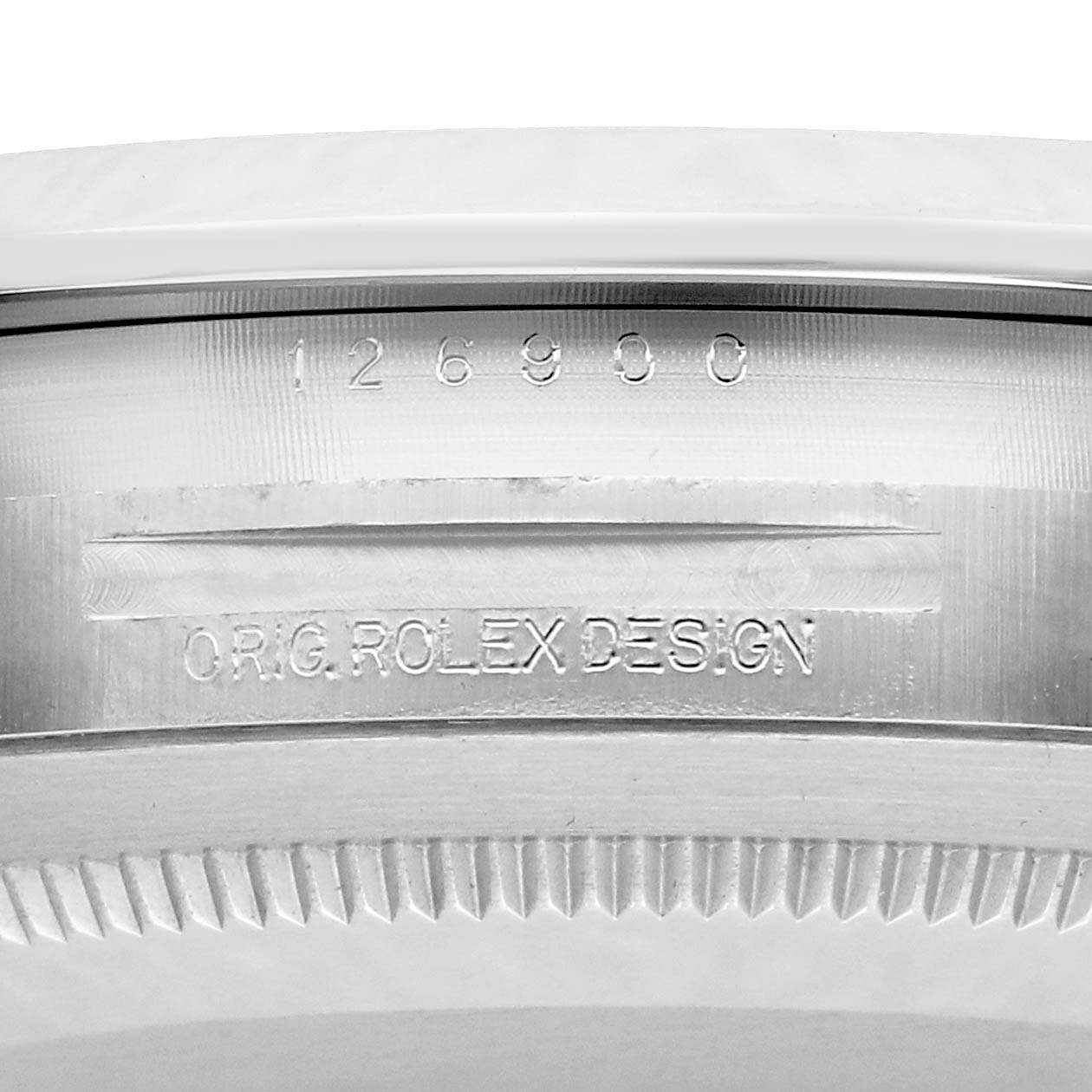 The image shows the engraved side of a Rolex Air-King 126900 Men
s Stainless Steel Black Dial, featuring the model number and "O.R.G. ROLEX DESIGN."