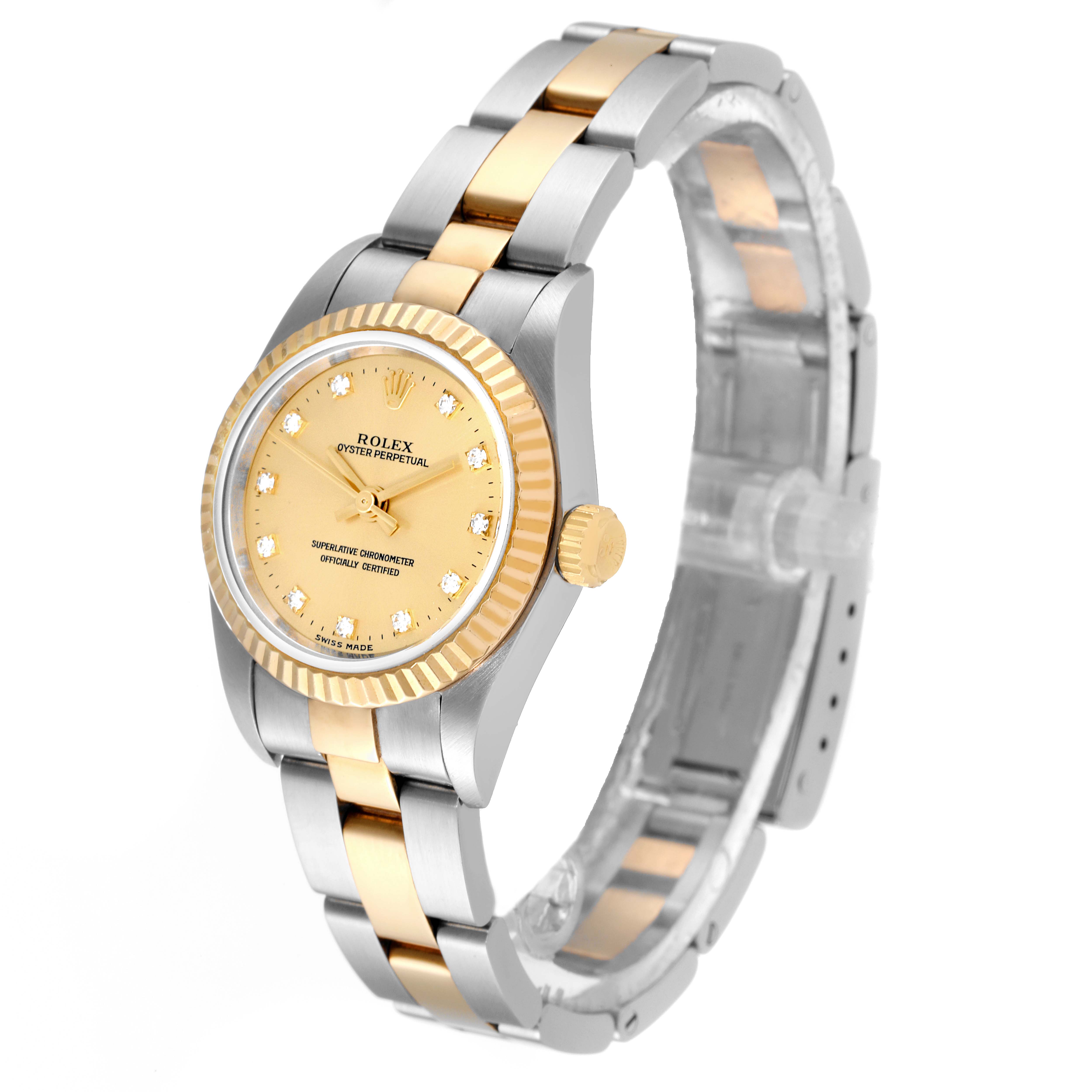 The image shows a Rolex Oyster Perpetual 76193 Women's Steel and Gold (two tone) Champagne Dial 76193 Women's Steel and Gold (two tone) Champagne Dial watch at a slight angle, highlighting the dial, bezel, case, crown, and bracelet.
