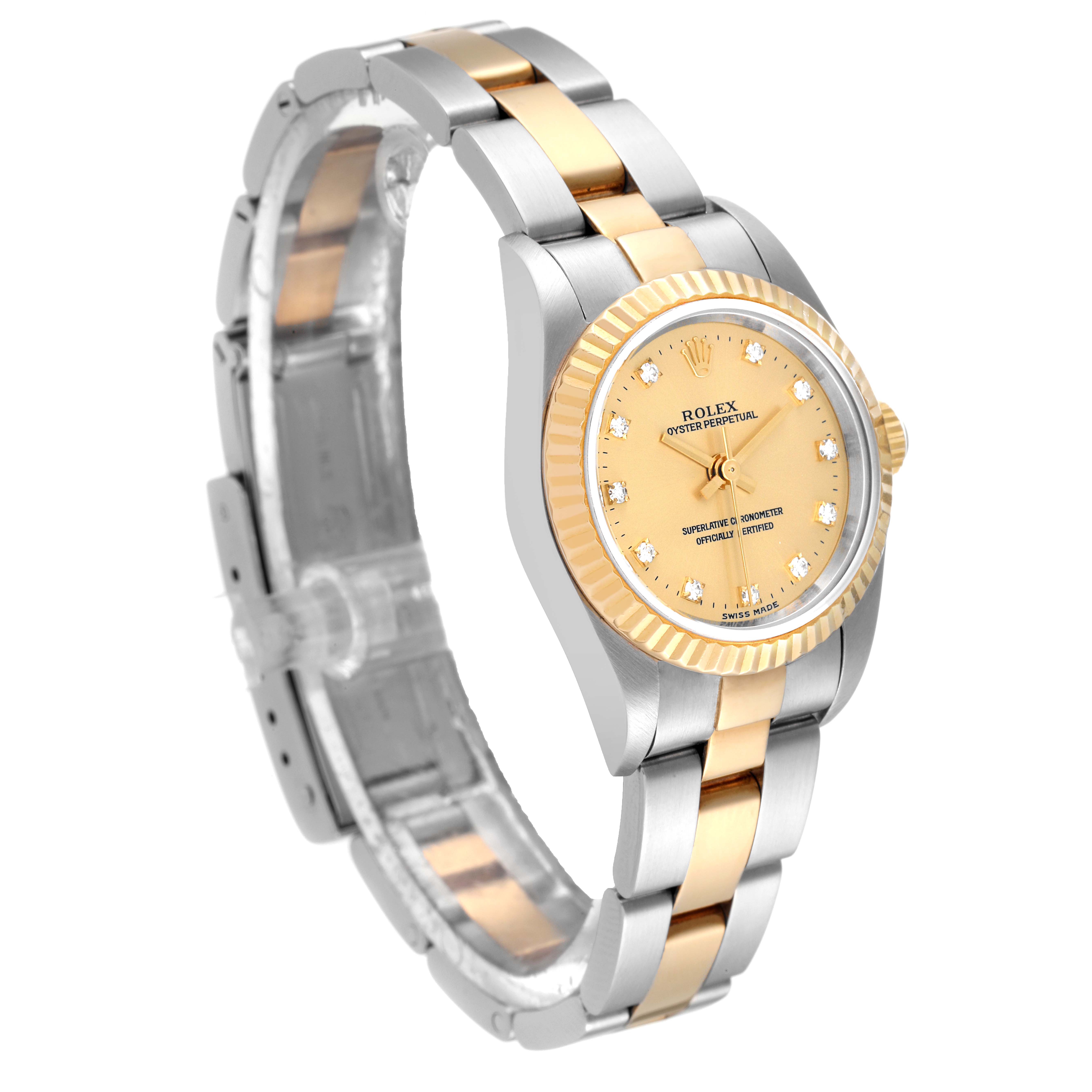 The image shows a Rolex Oyster Perpetual 76193 Women's Steel and Gold (two tone) Champagne Dial 76193 Women's Steel and Gold (two tone) Champagne Dial watch at a three-quarter angle, highlighting its gold dial and two-tone bracelet.