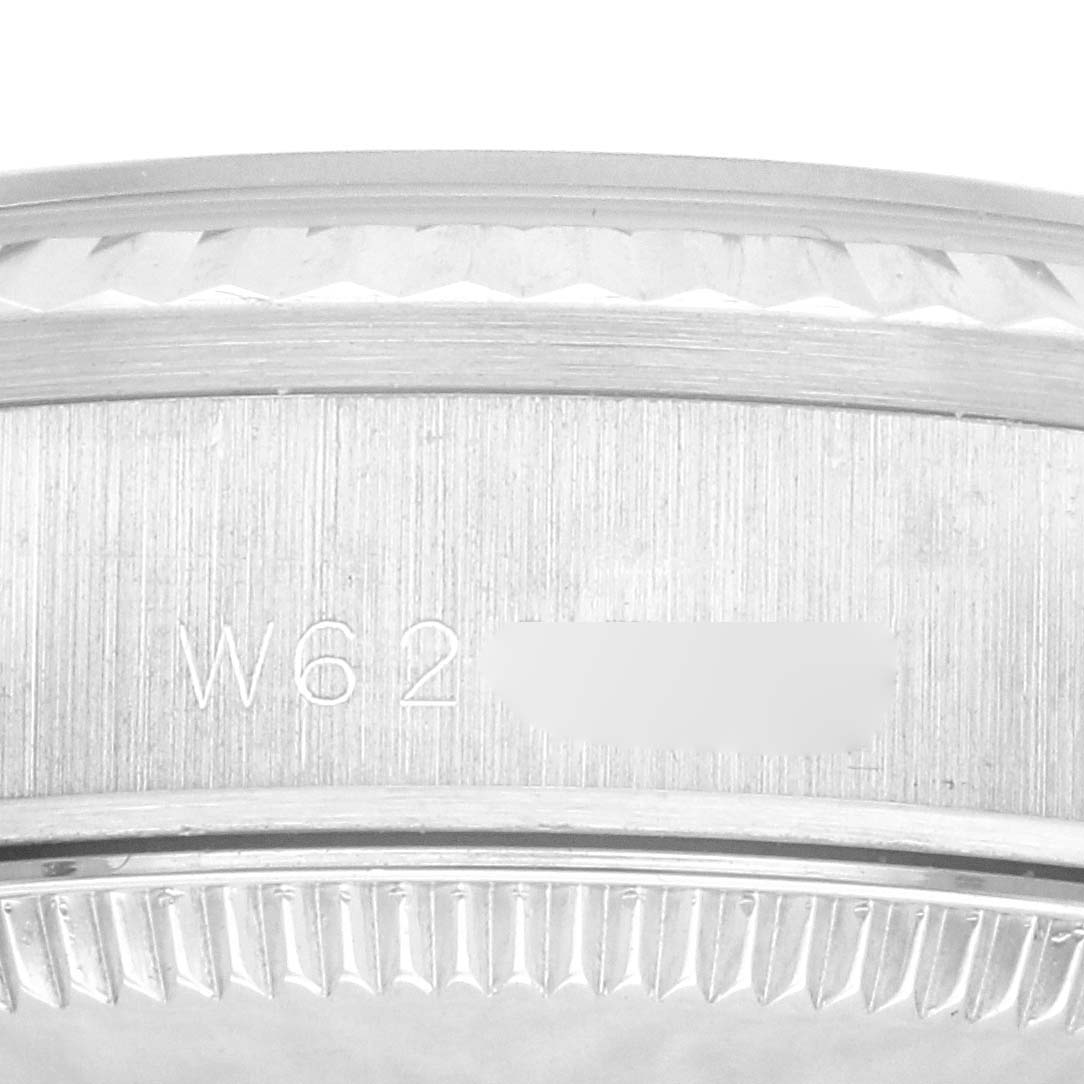 The image shows an angled close-up of the engraved caseback of a Rolex President 68279 Women's White Gold Silver Dial 68279 Women's White Gold Silver Dial model, featuring its serial number.