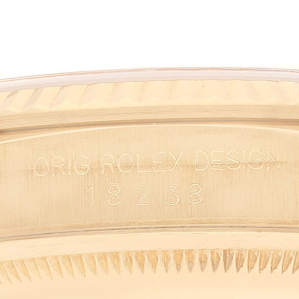 This close-up image shows the case side and edge engraving, including the model number, of the Rolex President 18238 Men
s Yellow Gold Champagne Dial 18238 Men
s Yellow Gold Champagne Dial watch.