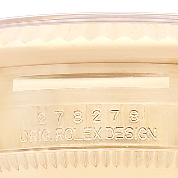 Close-up of the case and serial number on the Rolex President 278278 Women's Yellow Gold Green Dial 278278 Women's Yellow Gold Green Dial model watch, showing its engraving "ORIG. ROLEX DESIGN."