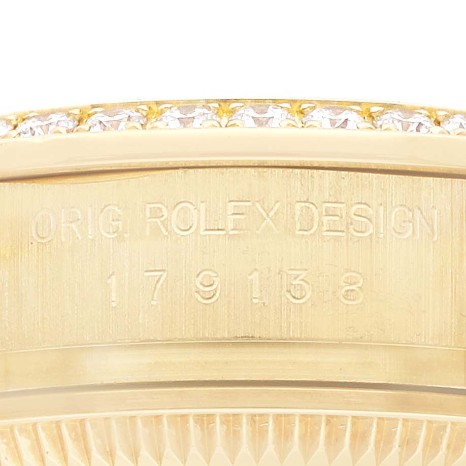 The image shows the engraved side of a Rolex President 179138 Women
s Yellow Gold Mother of Pearl Dial model, focusing on its design and model number.