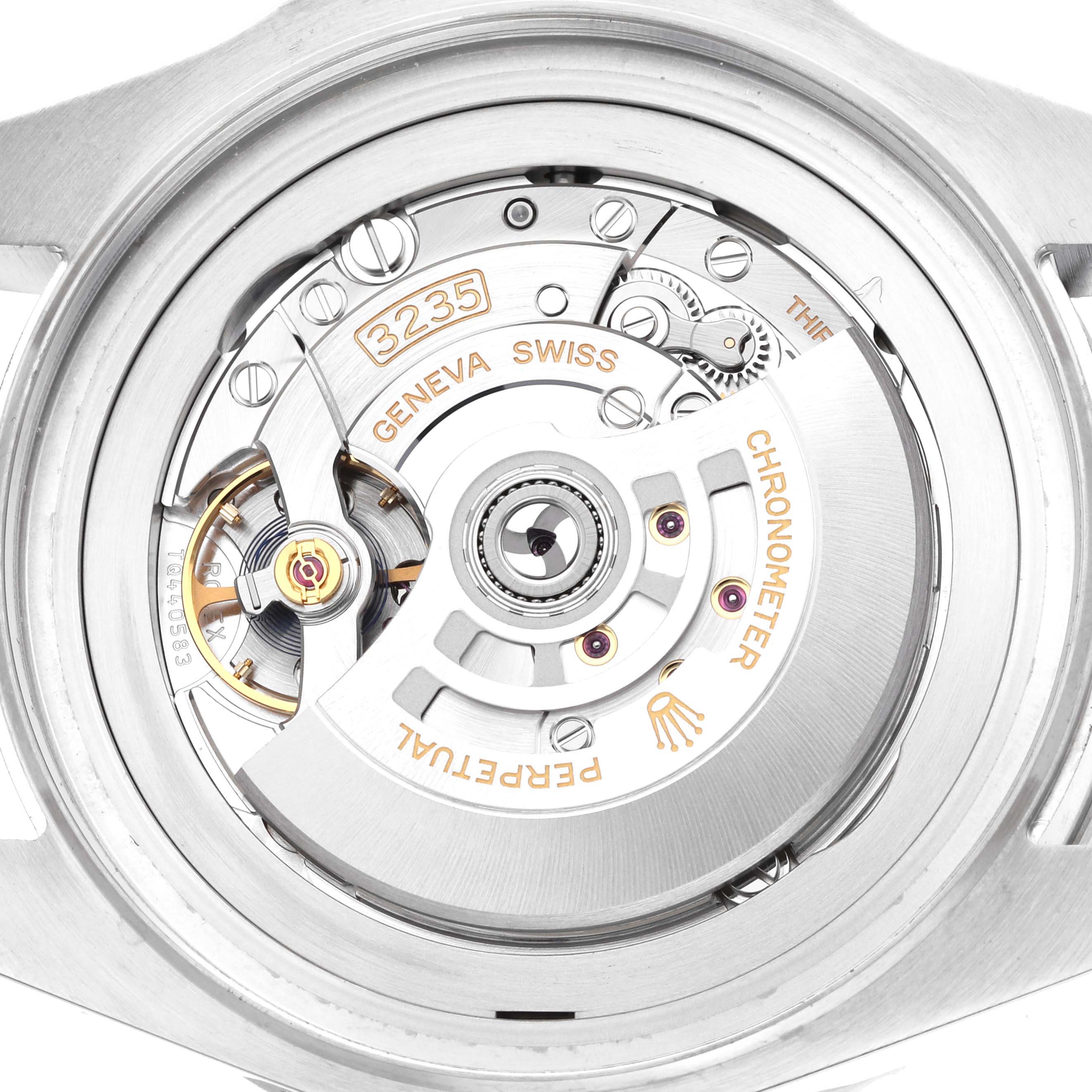 The image shows the movement from the back of a Rolex Sea-Dweller 136660 Men
s Stainless Steel Blue Dial, highlighting the intricate components and engravings.