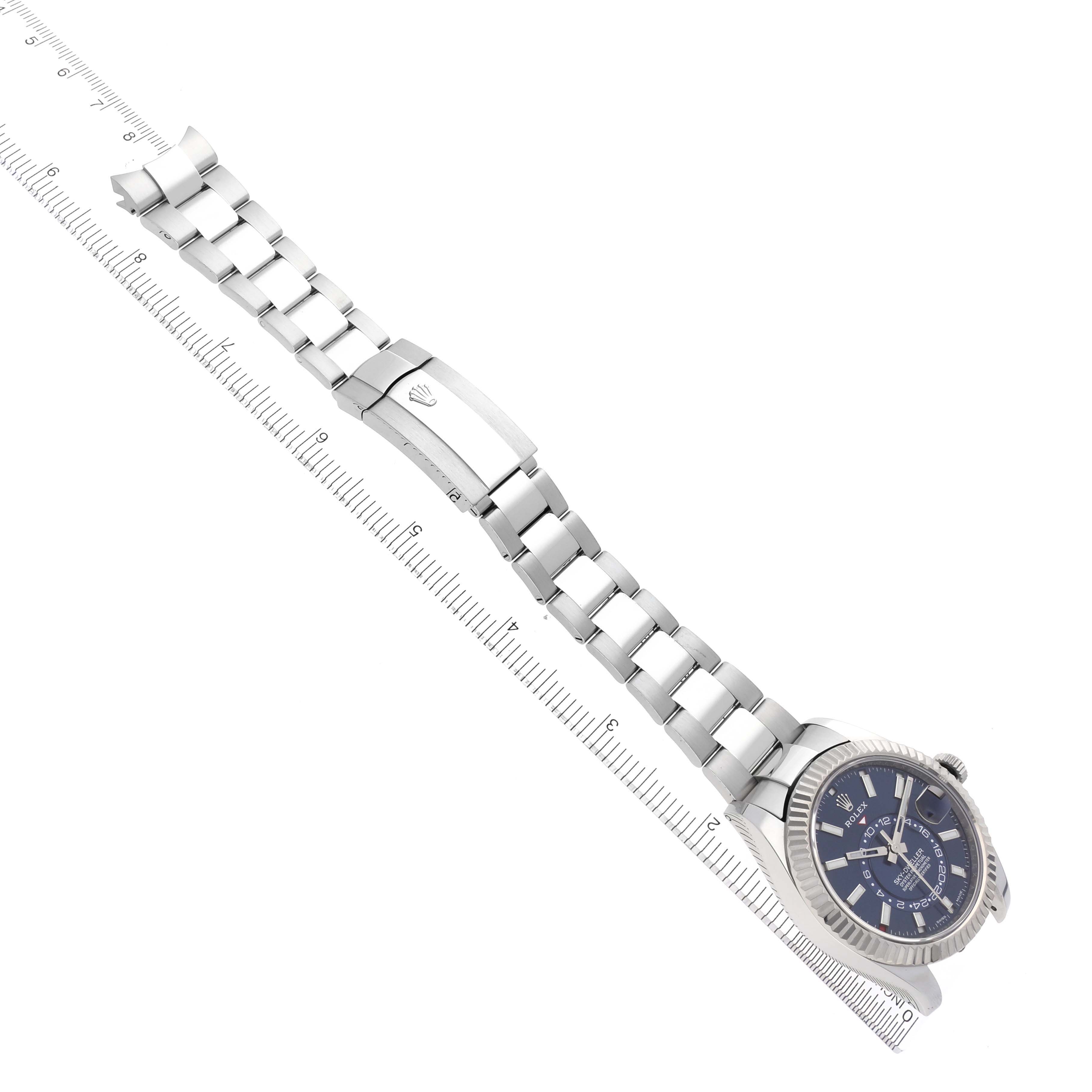 The image shows a Rolex Sky-Dweller 326934 Men's Stainless Steel Blue Dial 326934 Men's Stainless Steel Blue Dial watch diagonally laid out, displaying the full bracelet and clasp.