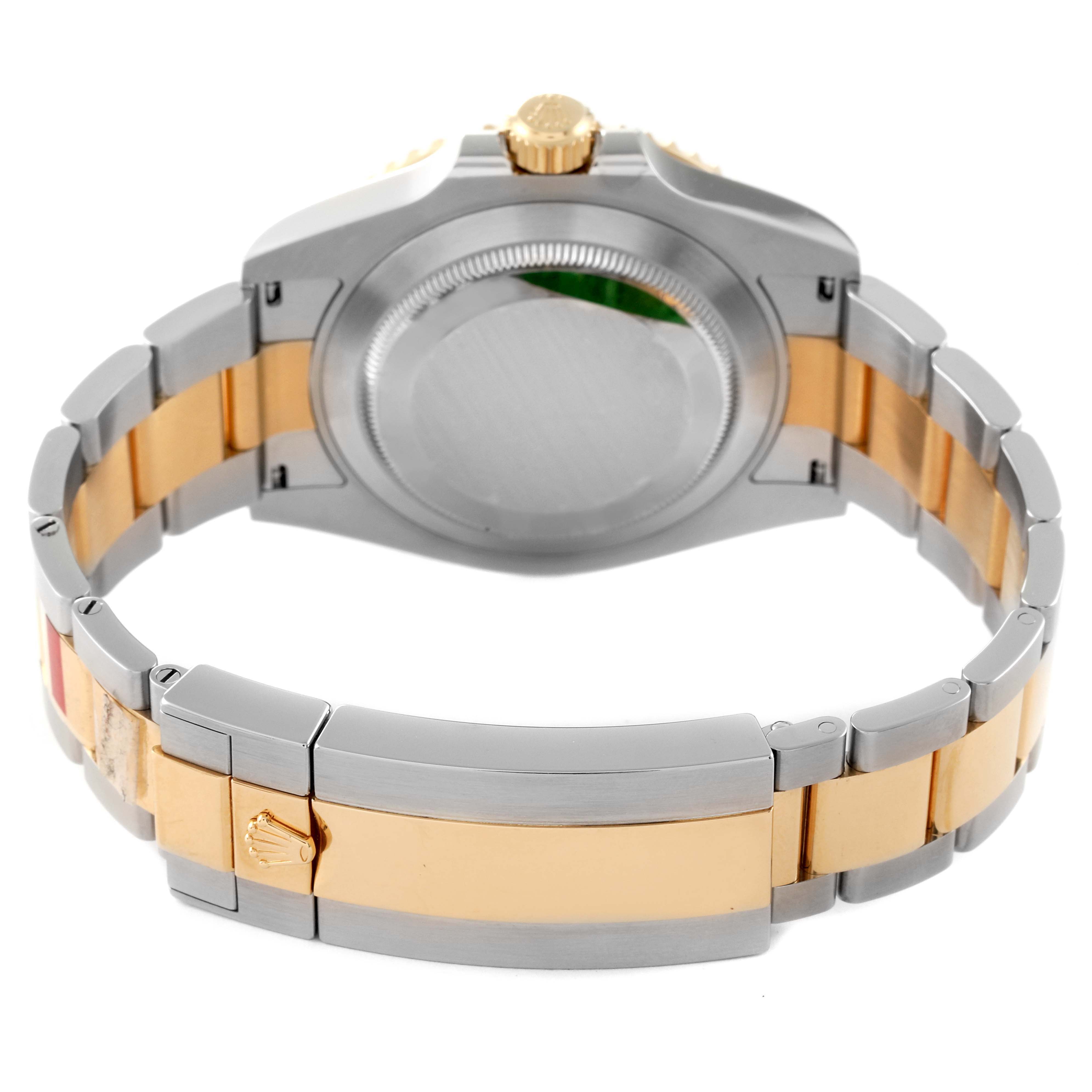 The image shows the back view of a Rolex Submariner 126613 Men
s Steel and Gold (two tone) Blue Dial 126613 Men
s Steel and Gold (two tone) Blue Dial watch, highlighting its case and the two-tone bracelet.