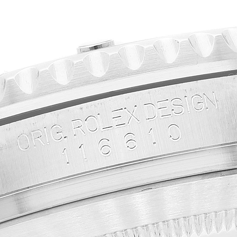 The image shows a close-up of the side of a Rolex Submariner 116610 Men
s Stainless Steel Black Dial 116610 Men
s Stainless Steel Black Dial watch, focusing on the bezel and engraved model number.