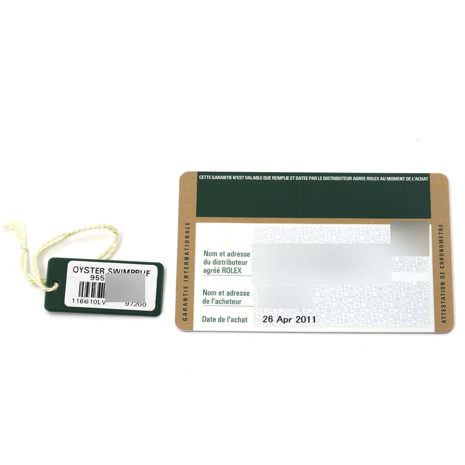 This image shows a warranty card and a tag for the Rolex Submariner 116610LV Men's Stainless Steel Green Dial 116610LV Men's Stainless Steel Green Dial model.