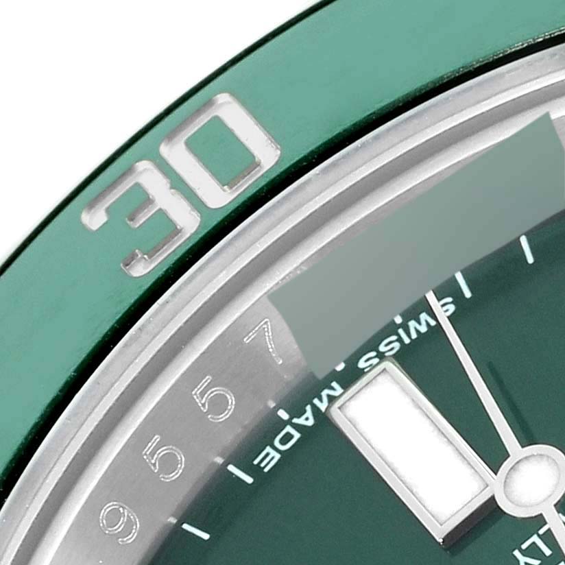 This is a close-up of the bezel and dial of a Rolex Submariner 116610LV Men's Stainless Steel Green Dial 116610LV Men's Stainless Steel Green Dial watch, showing the "30" minute marker and "SWISS MADE" text.
