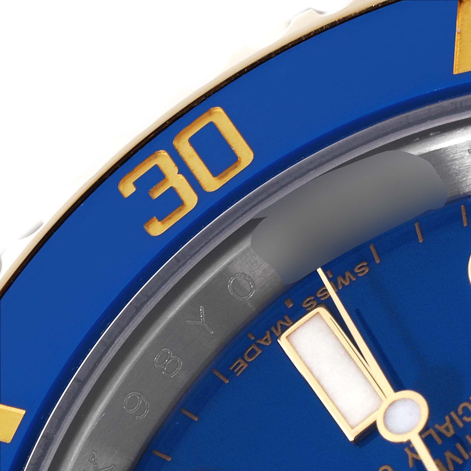 This close-up image of the Rolex Submariner 116613 Men's Steel and Gold (two tone) Blue Dial 116613 Men's Steel and Gold (two tone) Blue Dial watch highlights part of the blue bezel and dial, with the number "30" prominently shown.