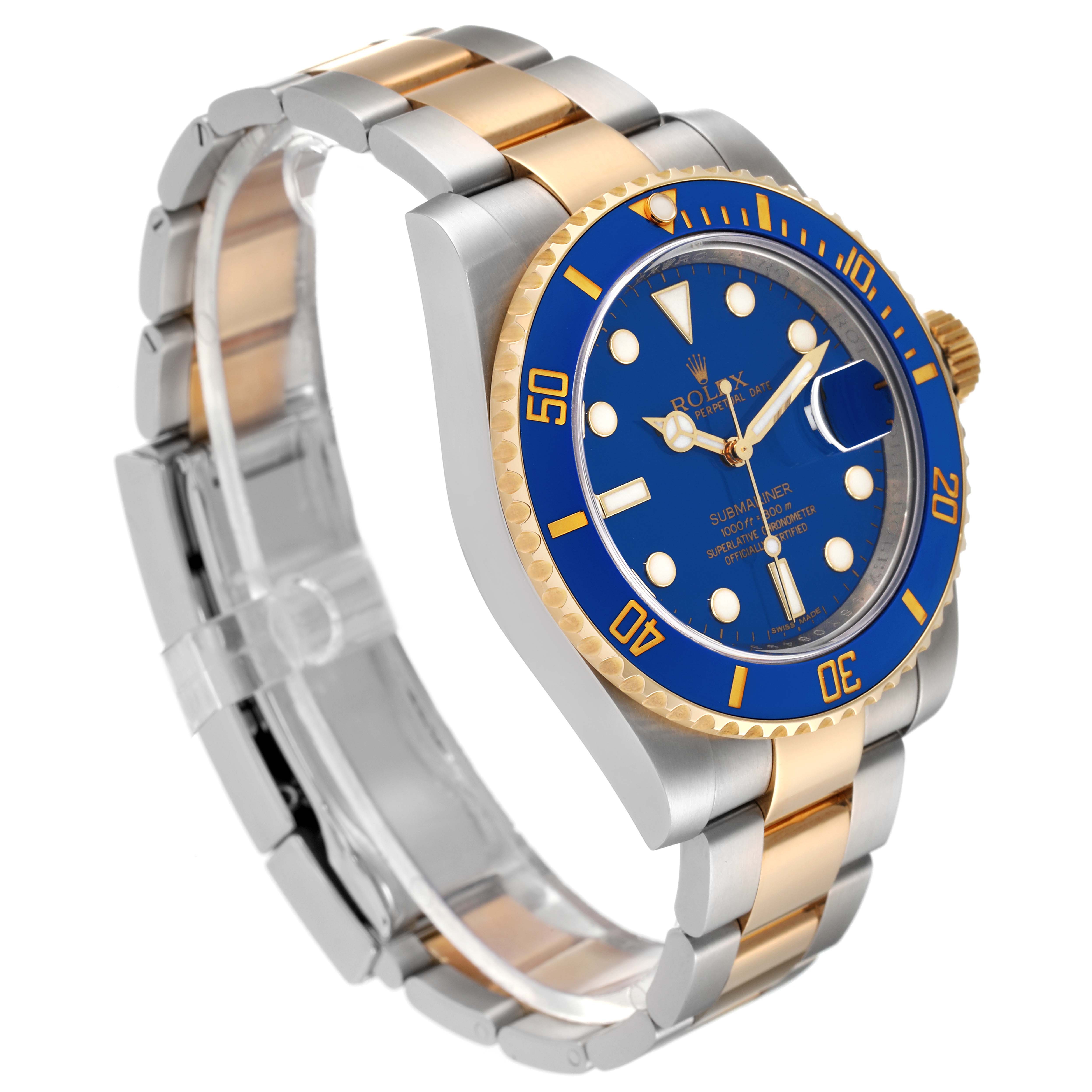 The image shows a Rolex Submariner 116613 Men's Steel and Gold (two tone) Blue Dial 116613 Men's Steel and Gold (two tone) Blue Dial watch at a three-quarter angle, highlighting its blue dial, bezel, and two-tone metal bracelet.
