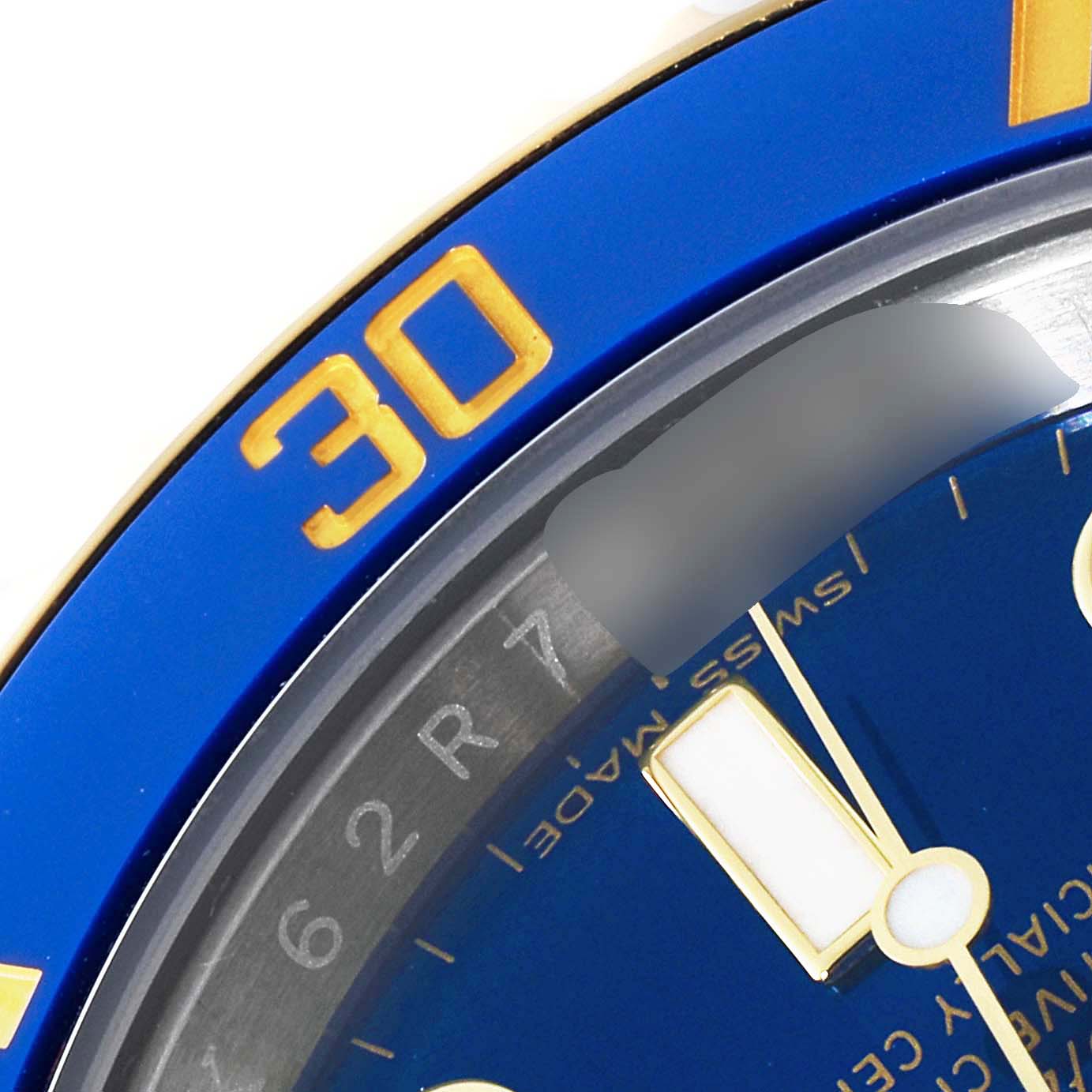 This close-up shot shows the blue bezel and part of the dial of the Rolex Submariner 116613 Men's Yellow Gold Blue Dial 116613 Men's Yellow Gold Blue Dial watch.