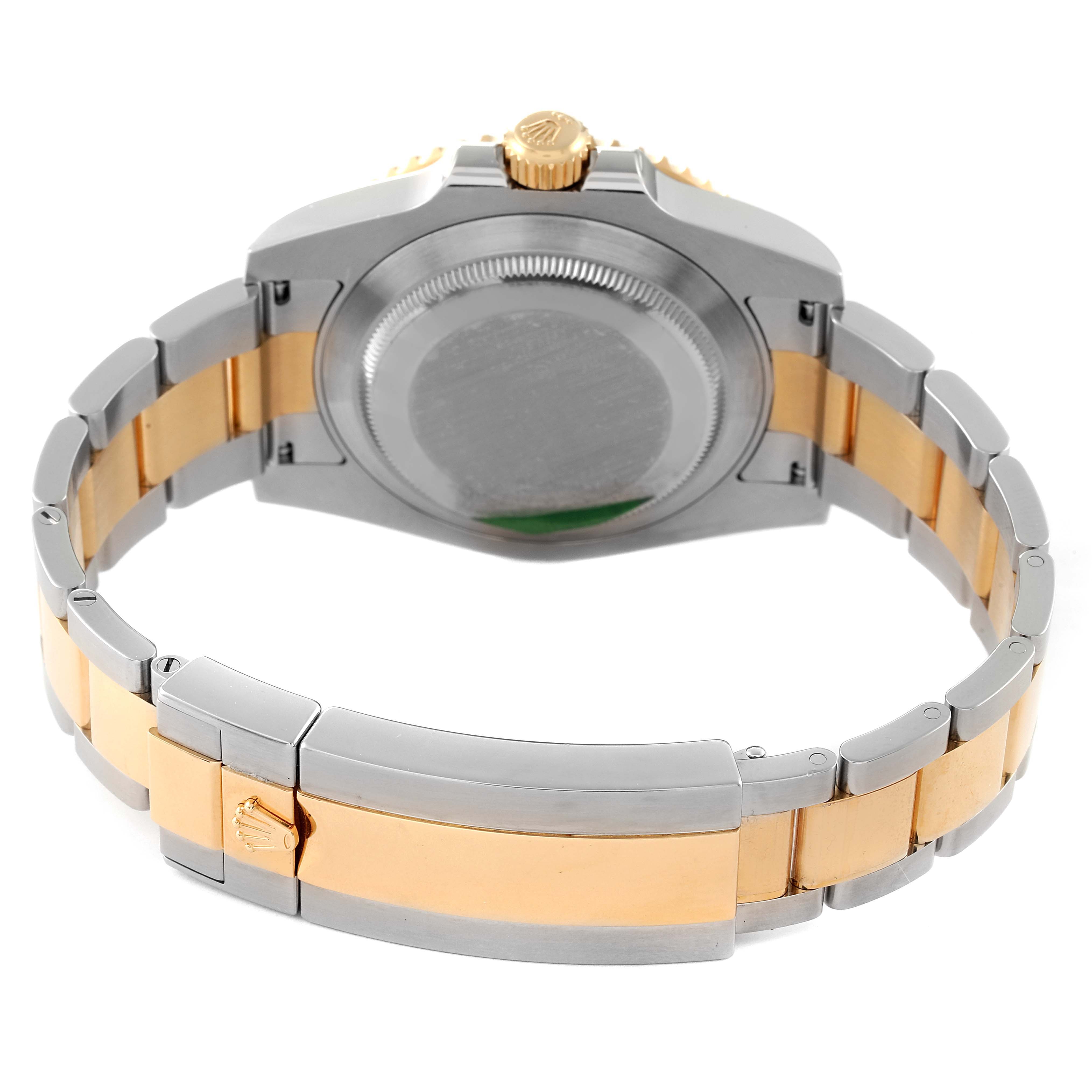 The image showcases the back of a Rolex Submariner 116613 Men's Yellow Gold Blue Dial 116613 Men's Yellow Gold Blue Dial watch, highlighting its case back, crown, and two-tone bracelet.