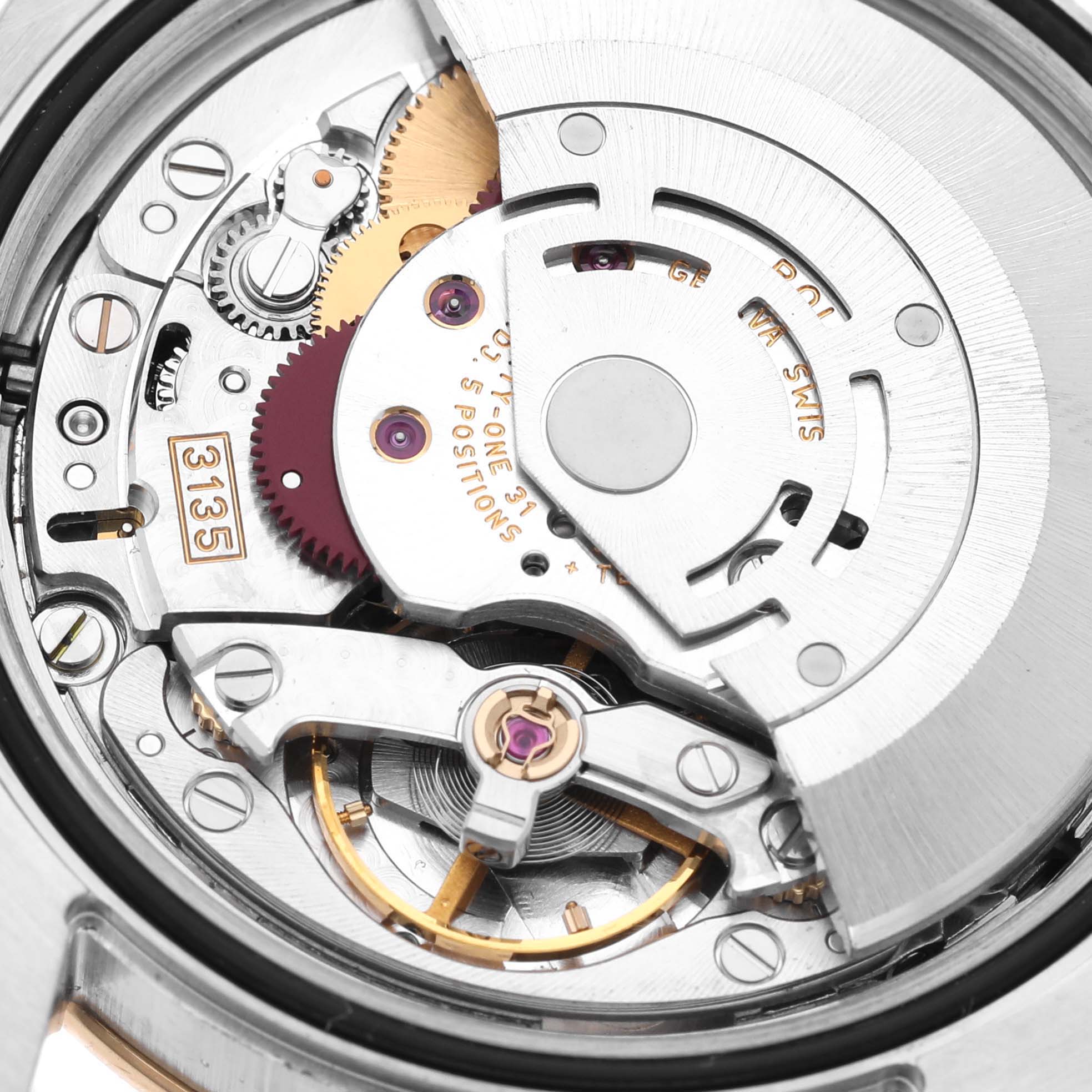 This image shows a close-up of the Rolex Turn-o-Graph 116263 Men's Steel and Gold (two tone) Black Dial 116263 Men's Steel and Gold (two tone) Black Dial movement, featuring the gears and balance wheel assembly.