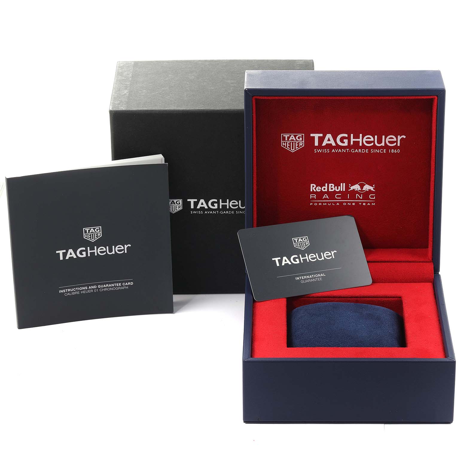 This image shows the Tag Heuer Carrera CAR2A1N.FT6100 Men's Stainless Steel Blue Dial CAR2A1N.FT6100 Men's Stainless Steel Blue Dial watch box, including the outer box, guarantee cards, and instruction booklet.