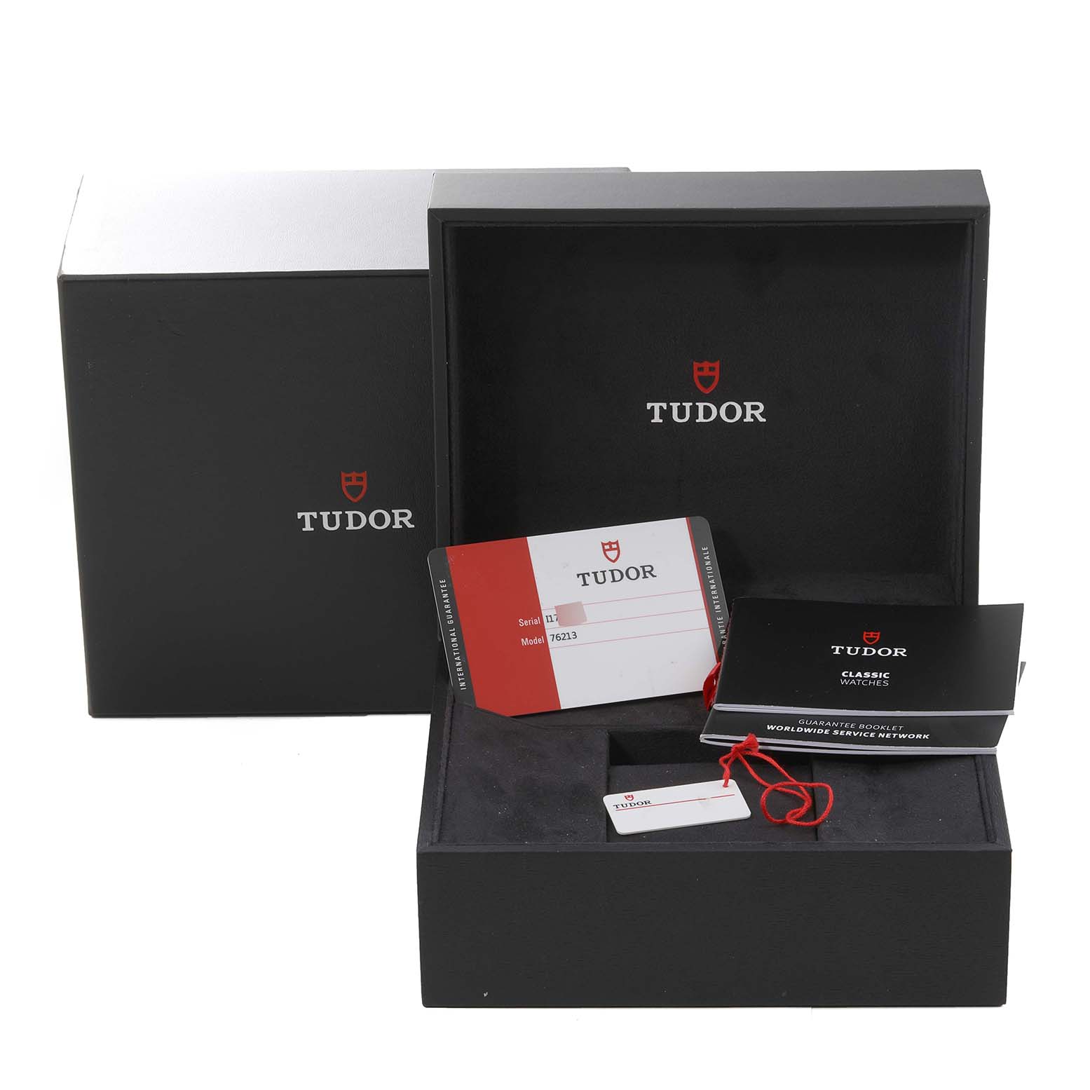 The image shows a Tudor Prince 76213 Men's Steel and Gold (two tone) Black Dial 76213 Men's Steel and Gold (two tone) Black Dial model watch box with guarantee cards and instruction booklets from a front angle.