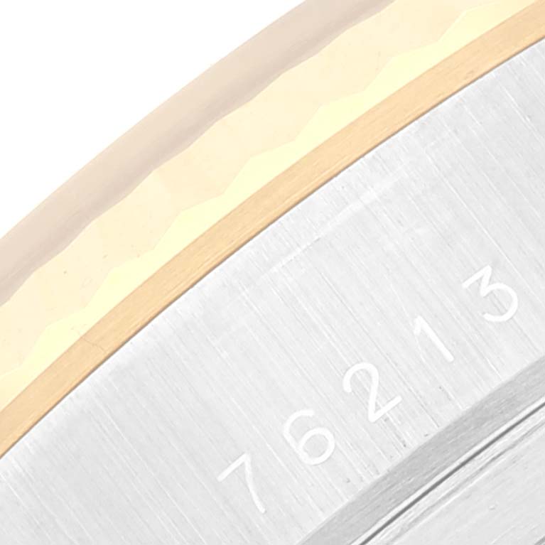 The image shows a close-up view of the bezel and case of the Tudor Prince 76213 Men's Steel and Gold (two tone) Black Dial 76213 Men's Steel and Gold (two tone) Black Dial model watch, displaying the serial number.