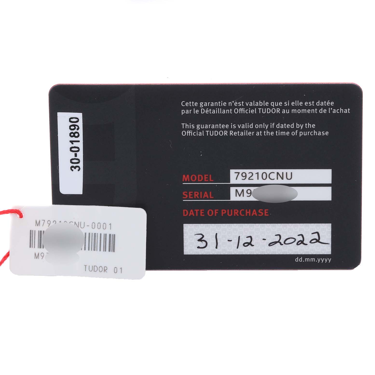 The image shows a warranty card and tag with model and serial details for the Tudor Heritage Black Bay 79210CNU Men's Ceramic Black Dial 79210CNU Men's Ceramic Black Dial watch.