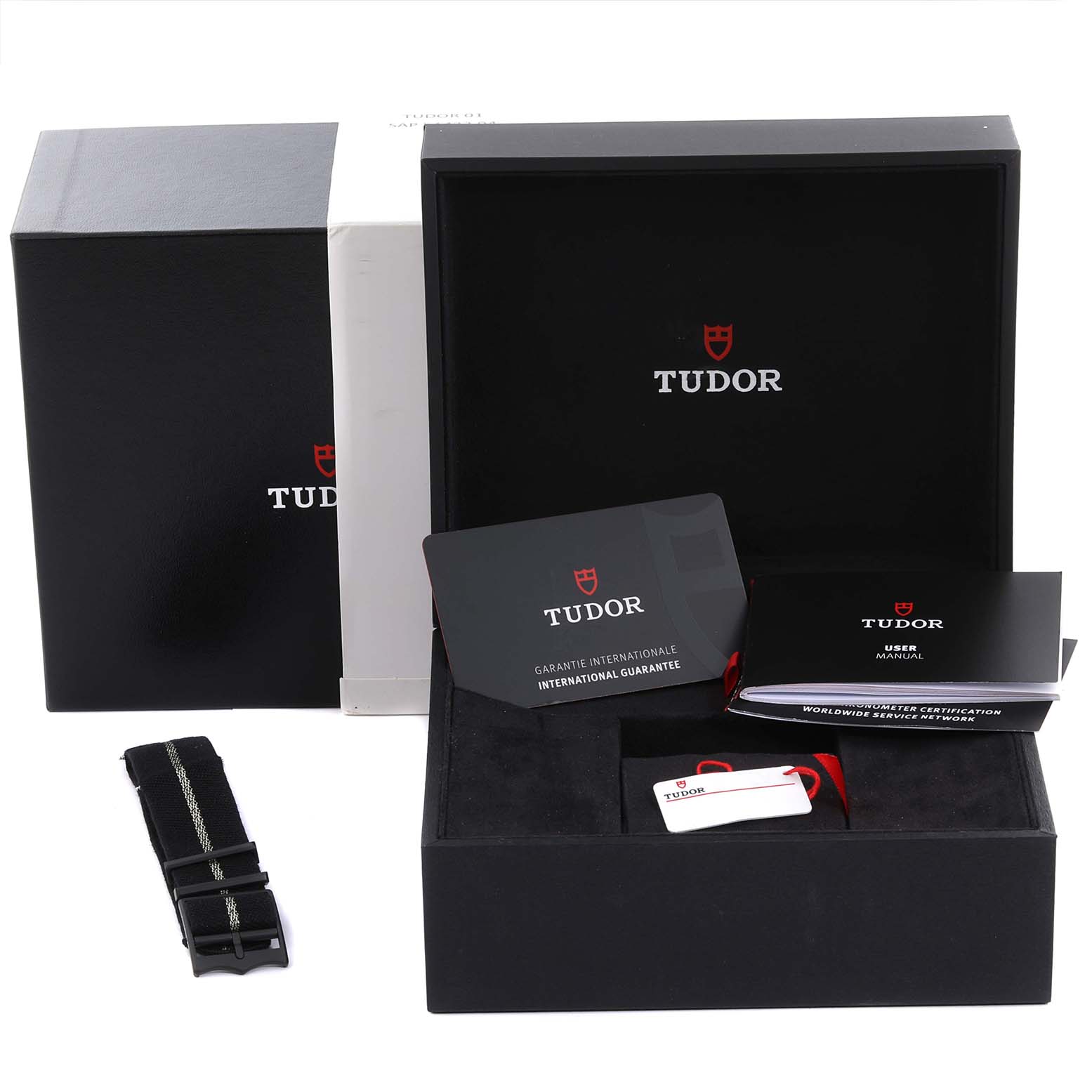 The image shows the Tudor Heritage Black Bay 79210CNU Men's Ceramic Black Dial 79210CNU Men's Ceramic Black Dial packaging with a box, strap, guarantee card, and user manual.