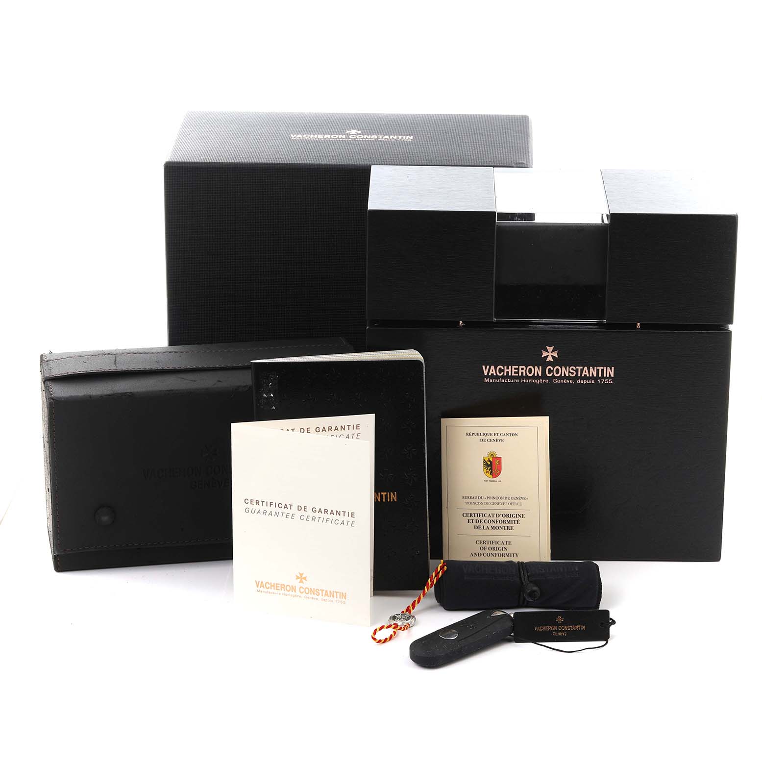 The image shows accessories for the Patrimony model by Vacheron Constantin, including the box and certificates.
