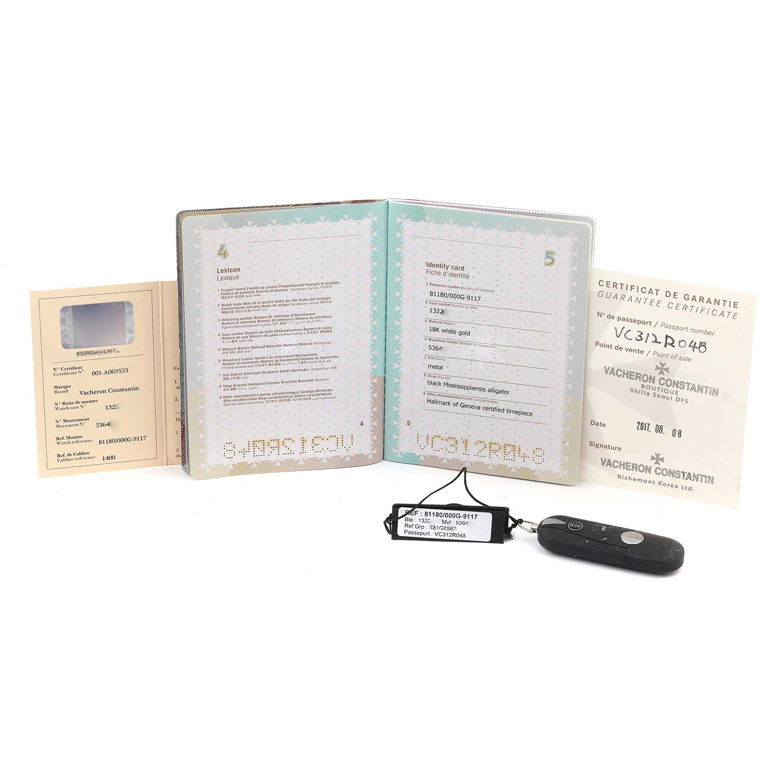 The image shows warranty documents and tags for the Vacheron Constantin Patrimony 81180/000G Men's White Gold Silver Dial 81180/000G Men's White Gold Silver Dial model.