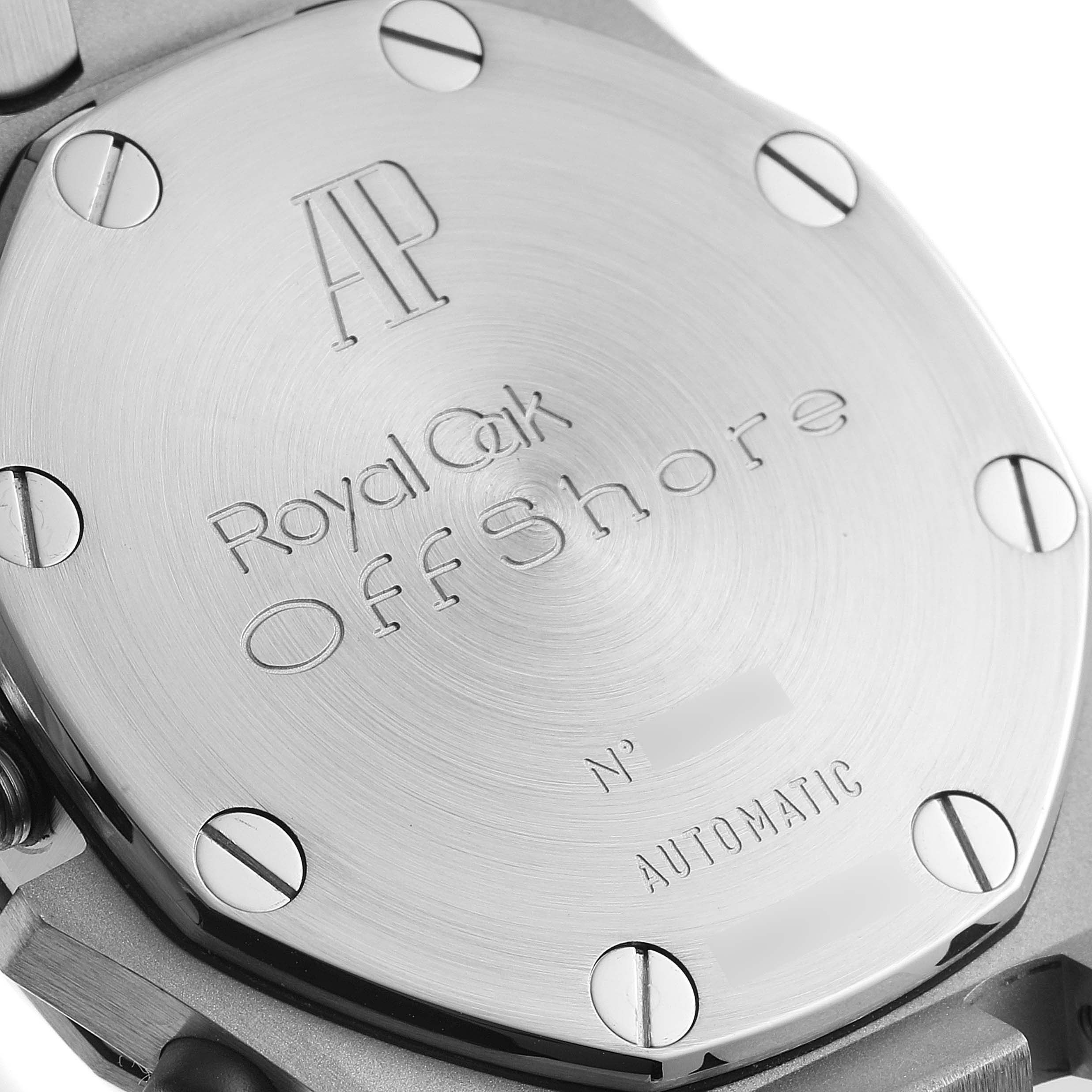 The image shows the case back of an Audemars Piguet Royal Oak Offshore 26170ST Men's Stainless Steel Black Dial watch, featuring engravings and screws.