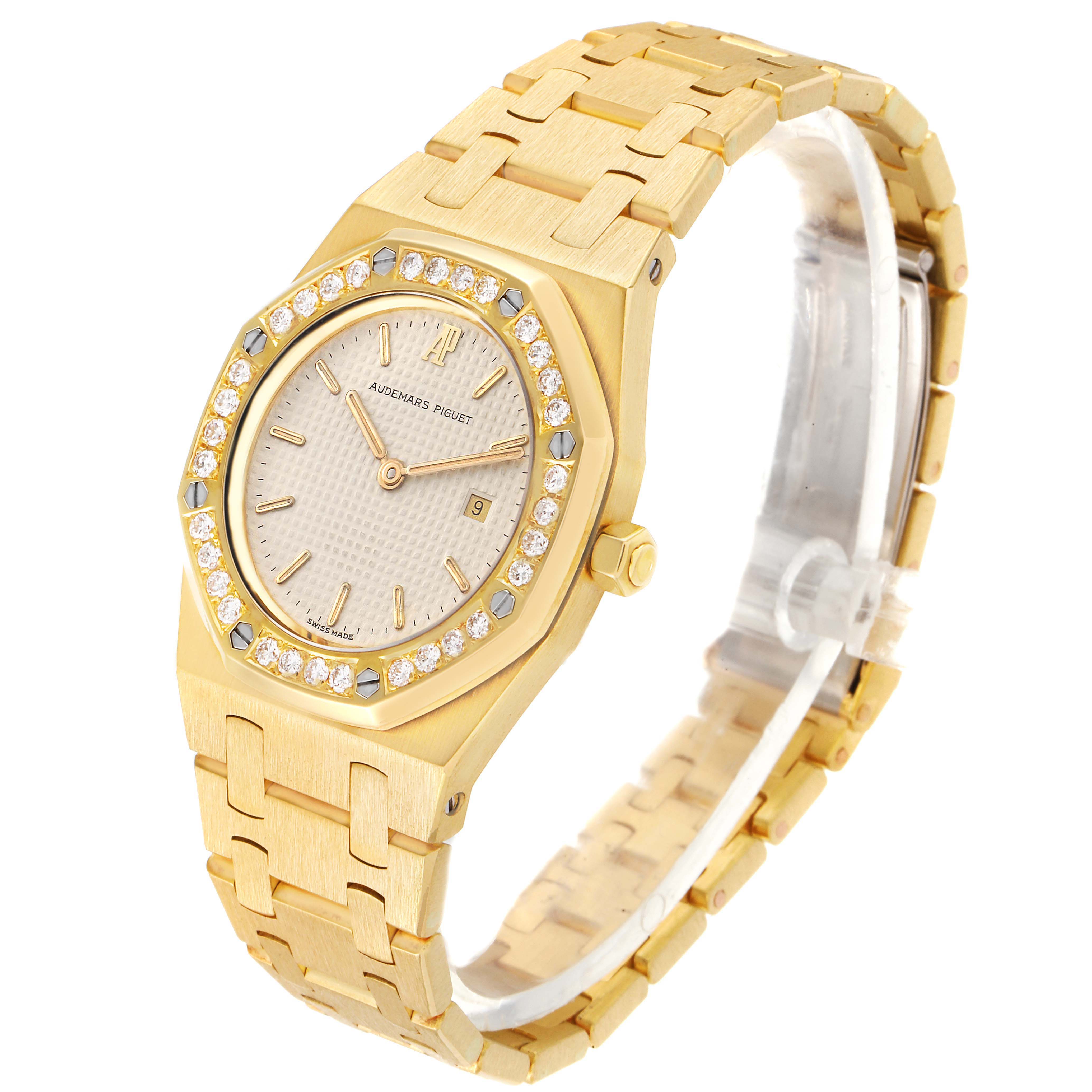 The image shows a side view of the Audemars Piguet Royal Oak 56271BA Women
s Yellow Gold Beige Dial 56271BA Women
s Yellow Gold Beige Dial watch, highlighting its bracelet, bezel, dial, and crown.