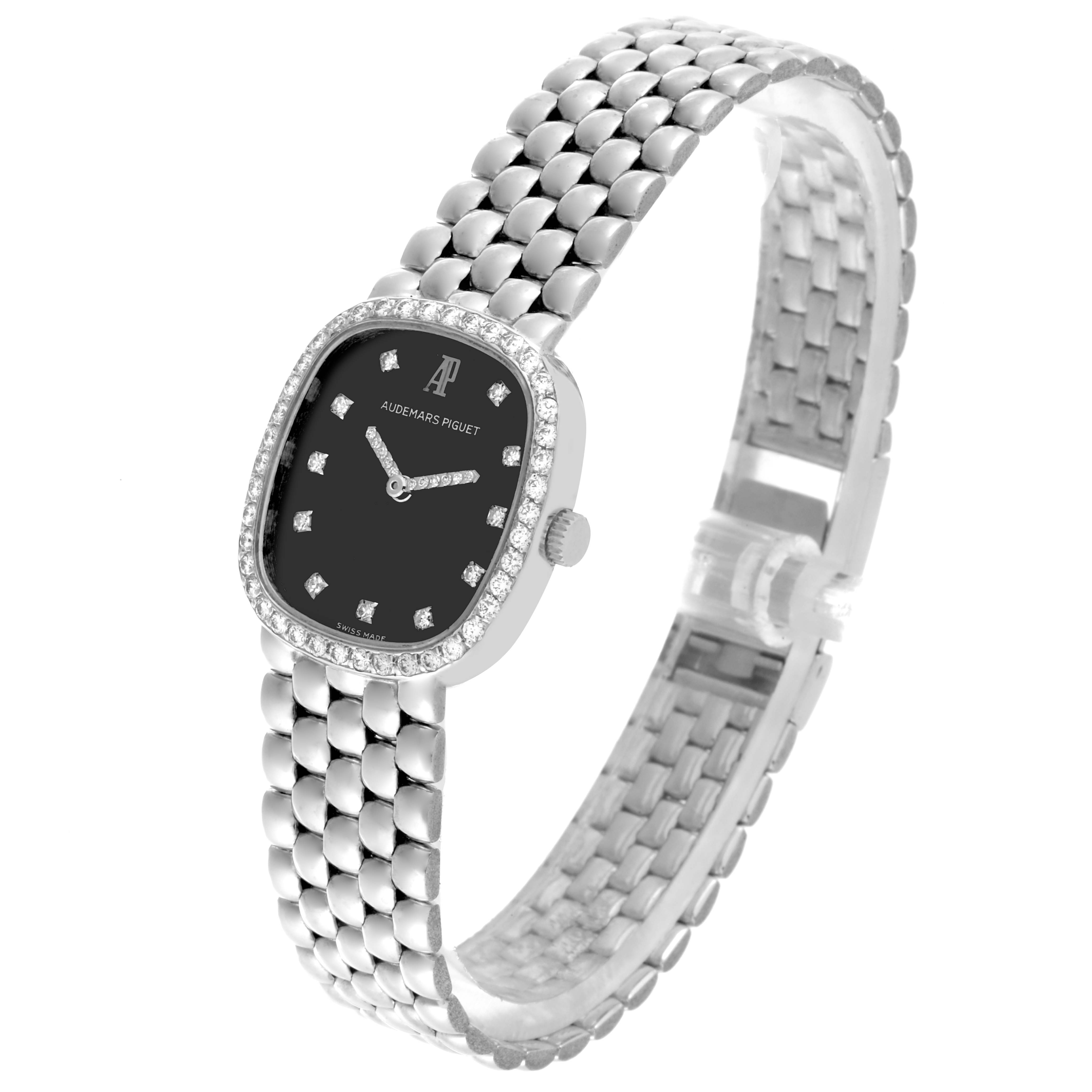 The Audemars Piguet Vintage Women's White Gold Black Dial Women's White Gold Black Dial watch is shown from an angle highlighting the face, bezel, and stainless steel bracelet.