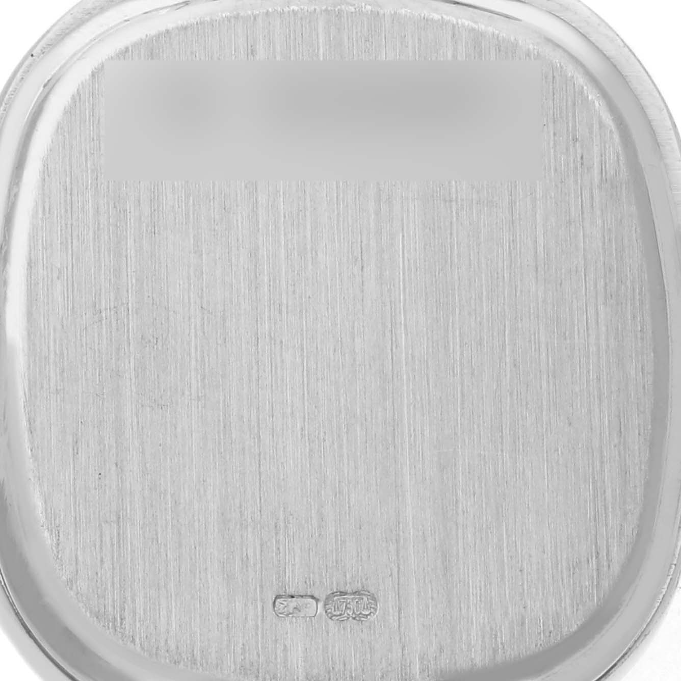 This image shows the back cover of a Vintage Audemars Piguet watch with hallmarks and brushed metal texture.