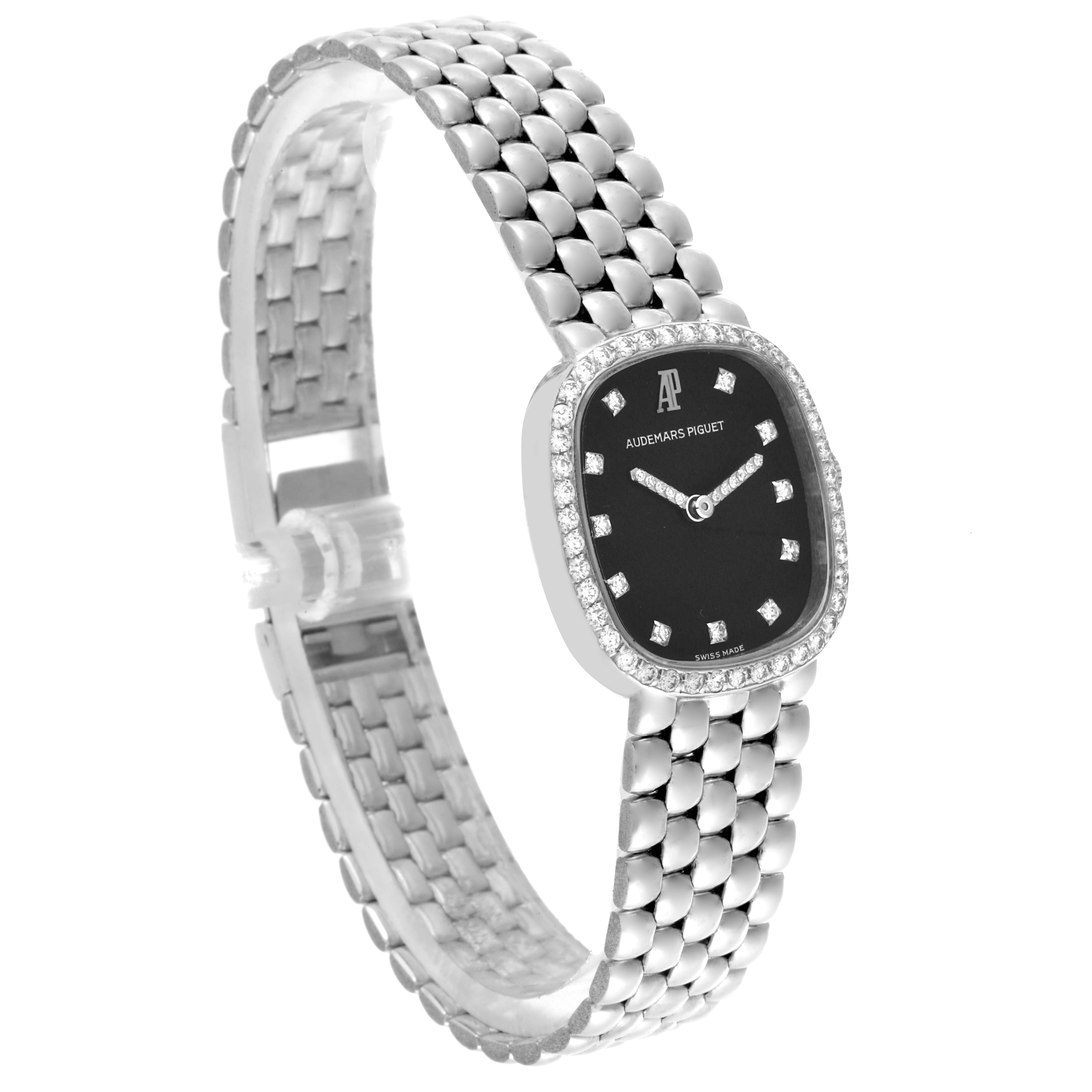 The Audemars Piguet Vintage Women's White Gold Black Dial Women's White Gold Black Dial watch is shown at a diagonal angle, displaying the black dial, diamond bezel, and metal bracelet.