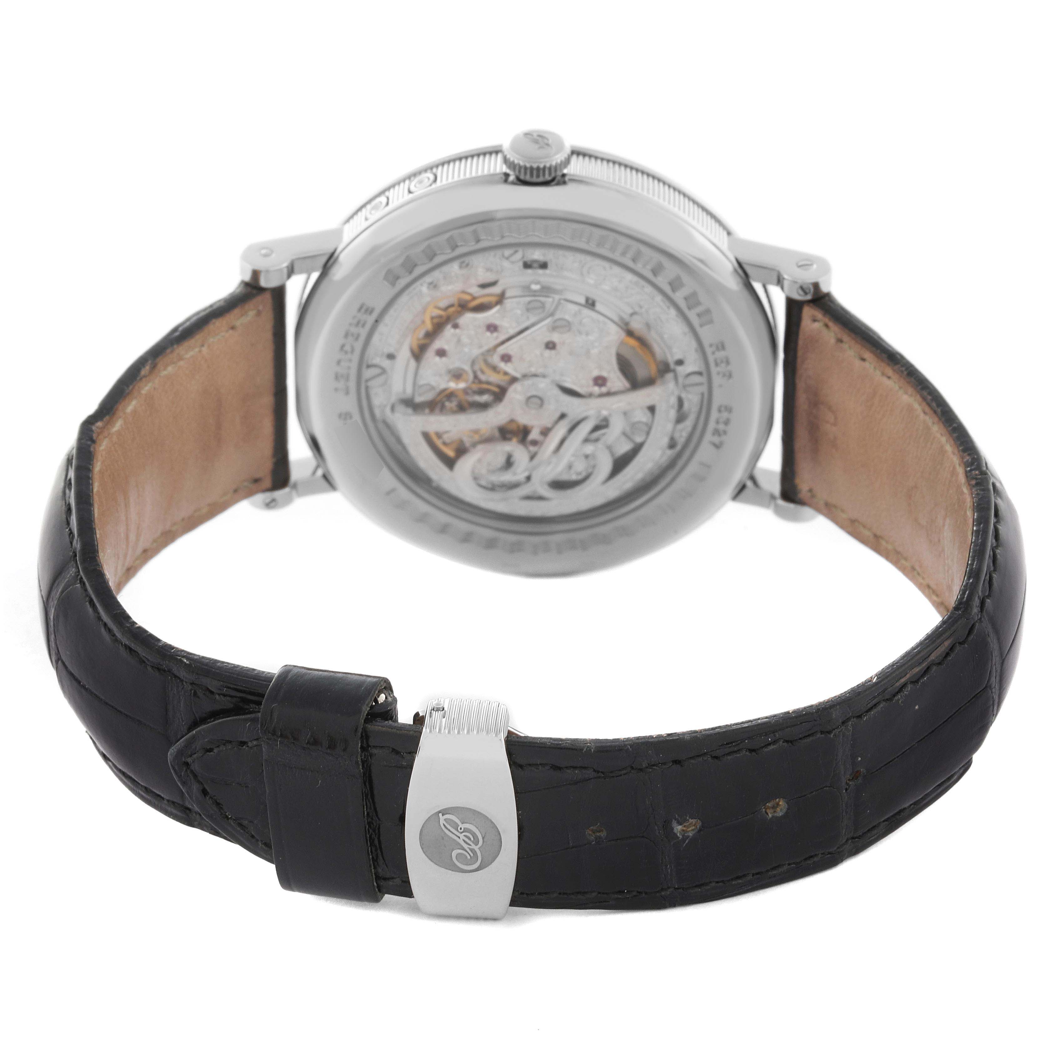 The Breguet Classique 5327BB/1E/9V6 Men's White Gold Silver Dial 5327BB/1E/9V6 Men's White Gold Silver Dial watch is shown from the back, displaying the transparent caseback and leather strap with buckle.