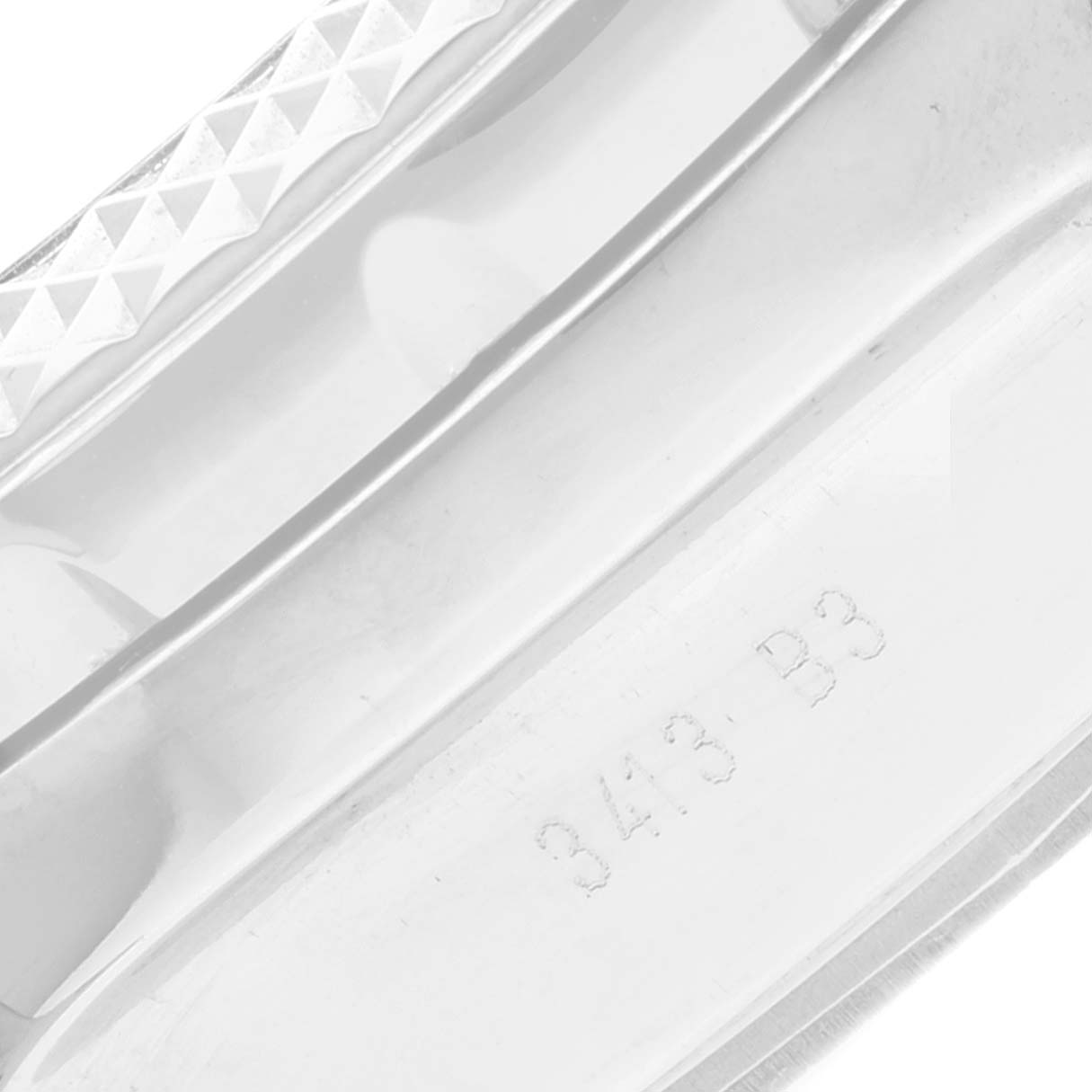 Close-up of the engraved bezel edge and part of the dial of a Bentley model by Breitling.