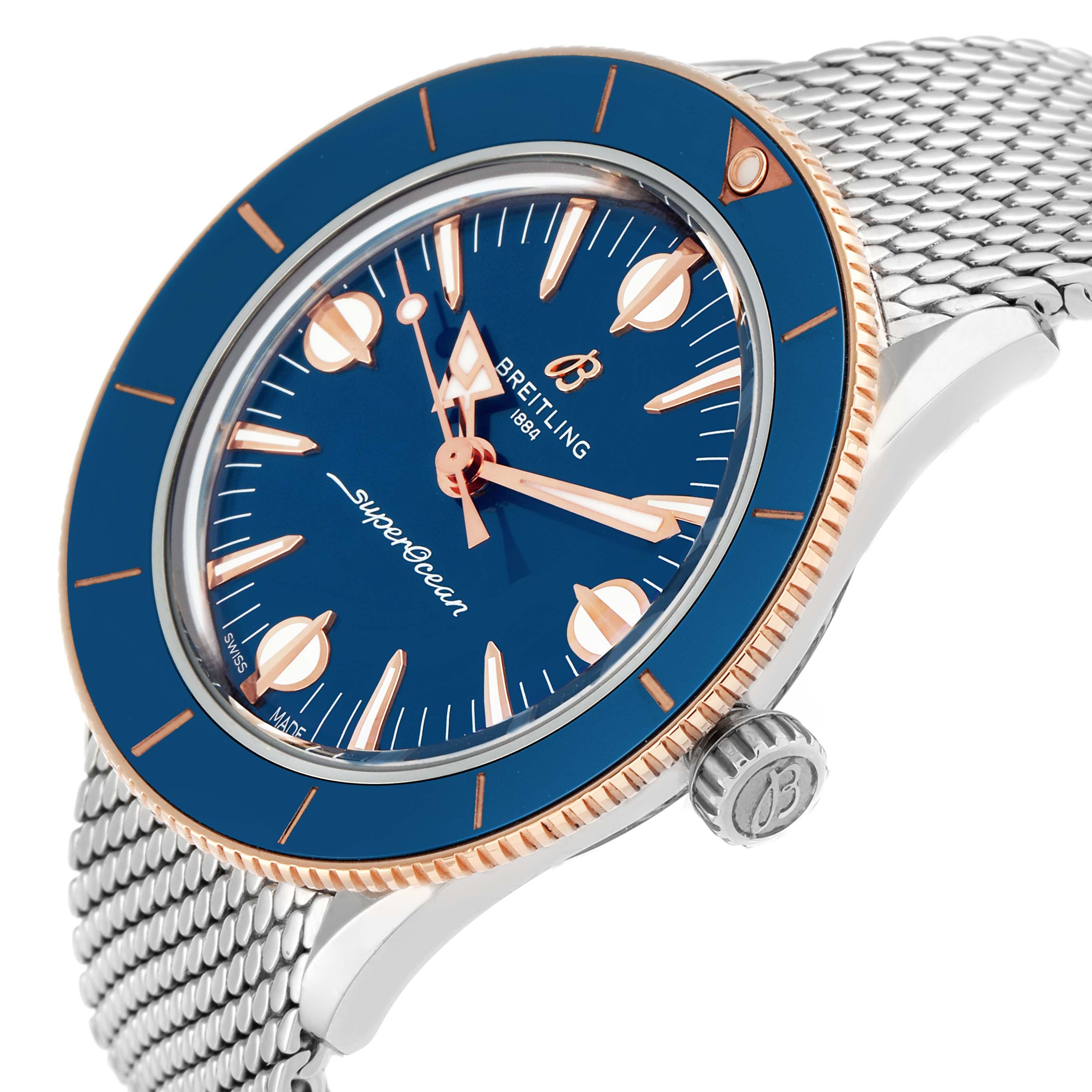 The Breitling Superocean U10340 Men
s Stainless Steel Blue Dial watch is shown at an angle emphasizing the blue dial, rose gold accents, bezel, crown, and mesh bracelet.