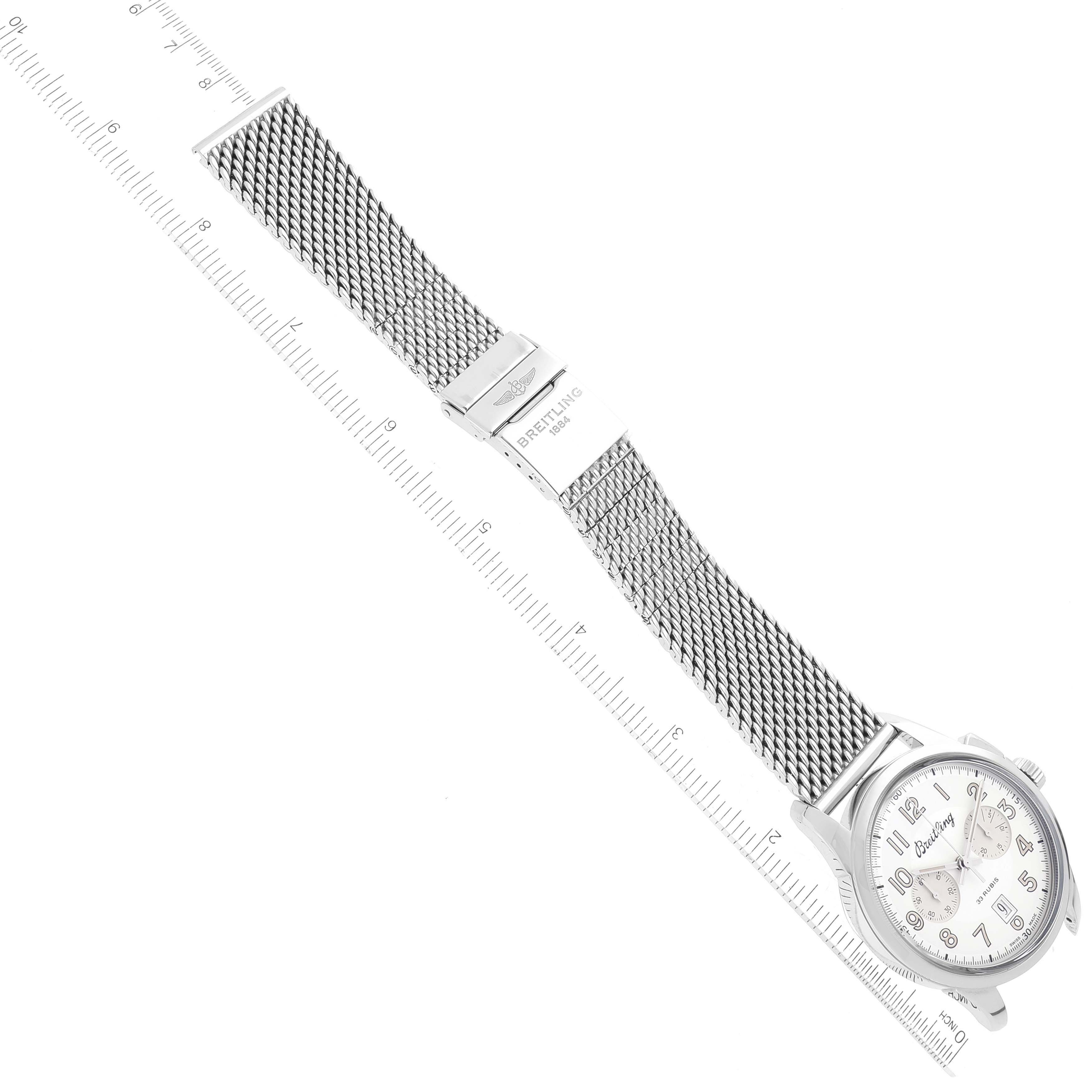 The image shows the Breitling Transocean AB141112/G799-154A Men's Stainless Steel Silver Dial AB141112/G799-154A Men's Stainless Steel Silver Dial watch laid flat with a metal mesh bracelet and a clasp, viewed from above.